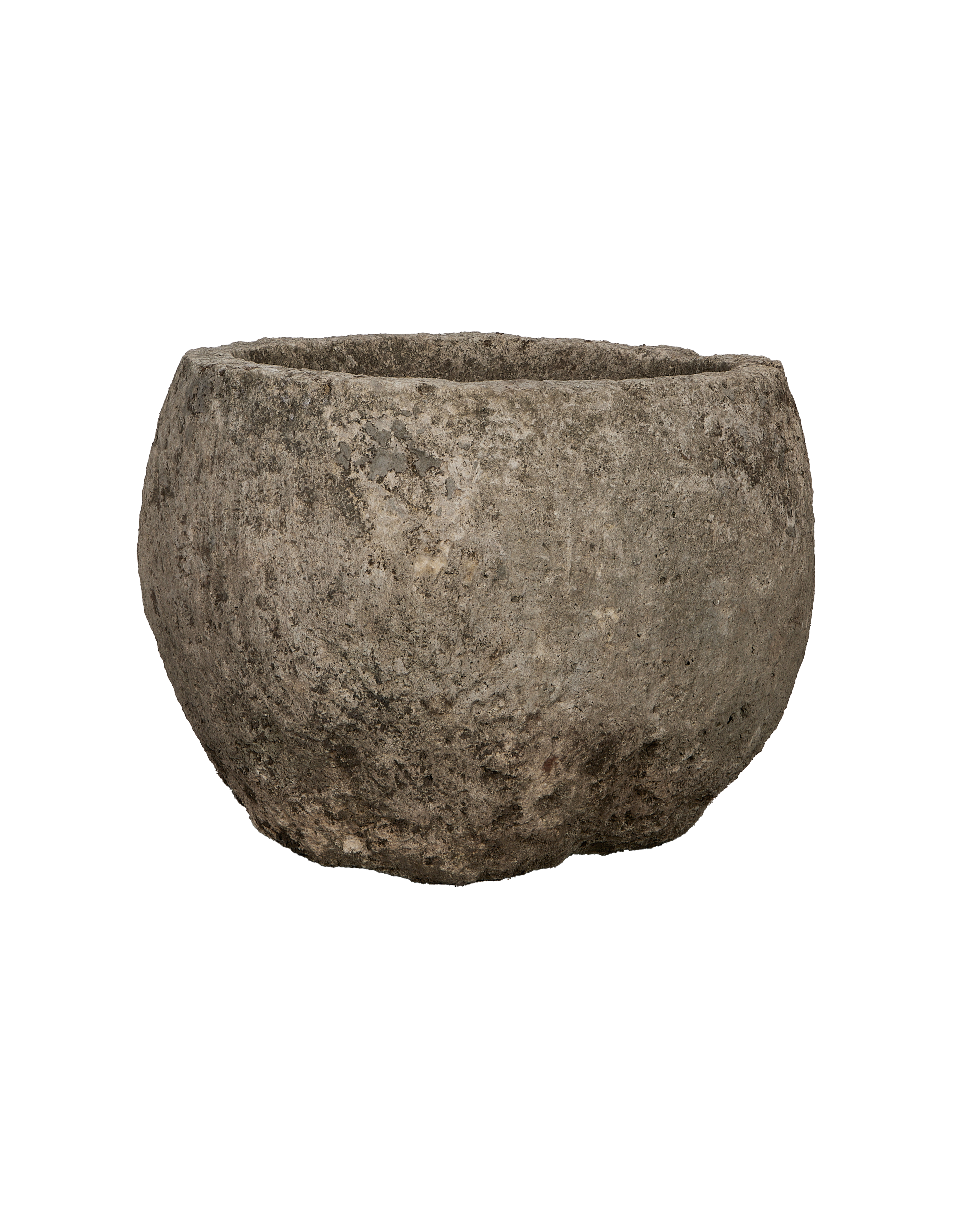 Vintage round Indonesian limestone trough, showing entire rough exterior texture and shape.