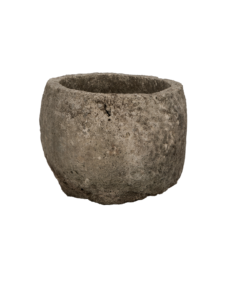 Round vintage Indonesian limestone trough, OAK finish, showing rough texture and natural surface imperfections.