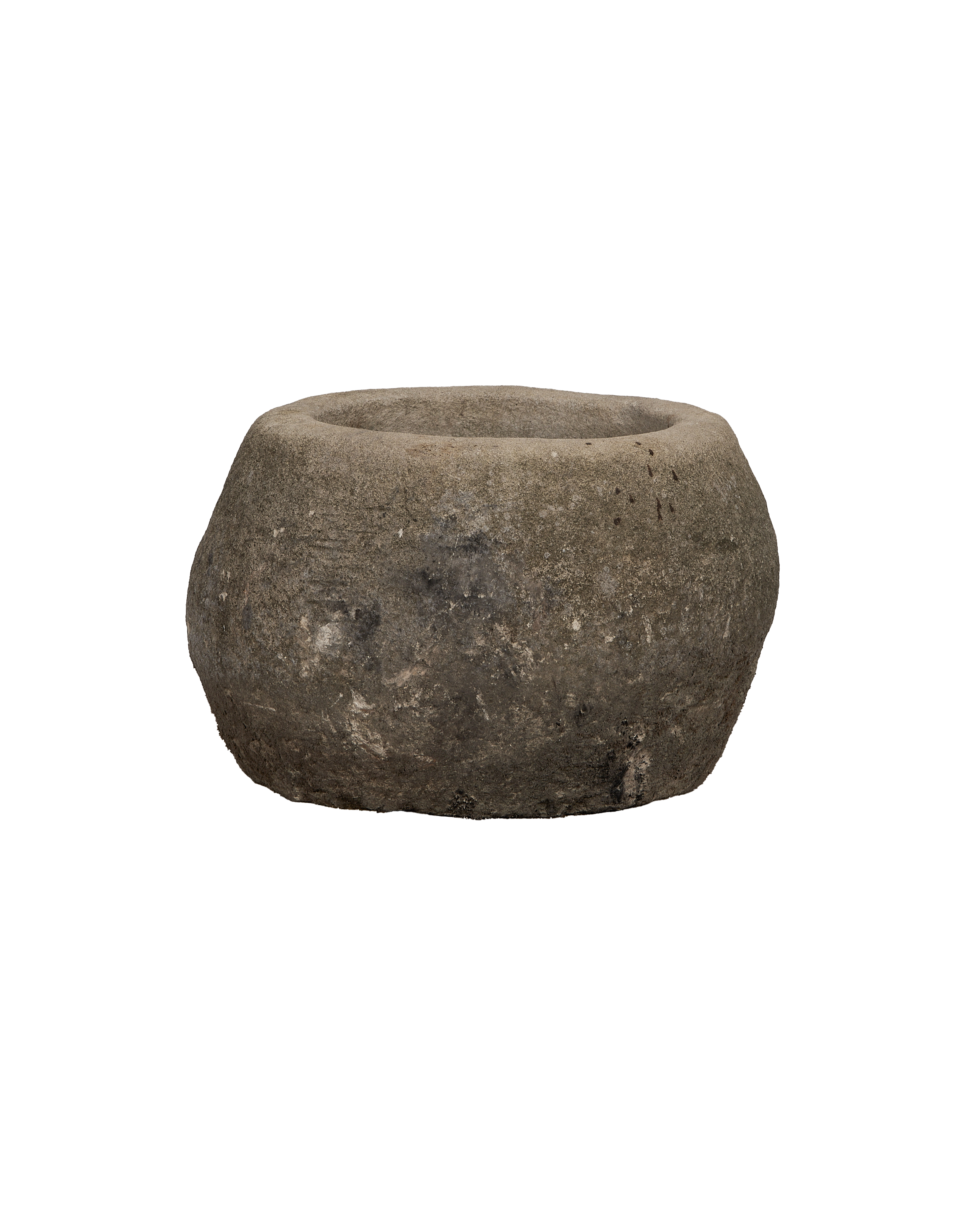 Vintage Indonesian round limestone trough, showing weathered texture from an elevated angle.