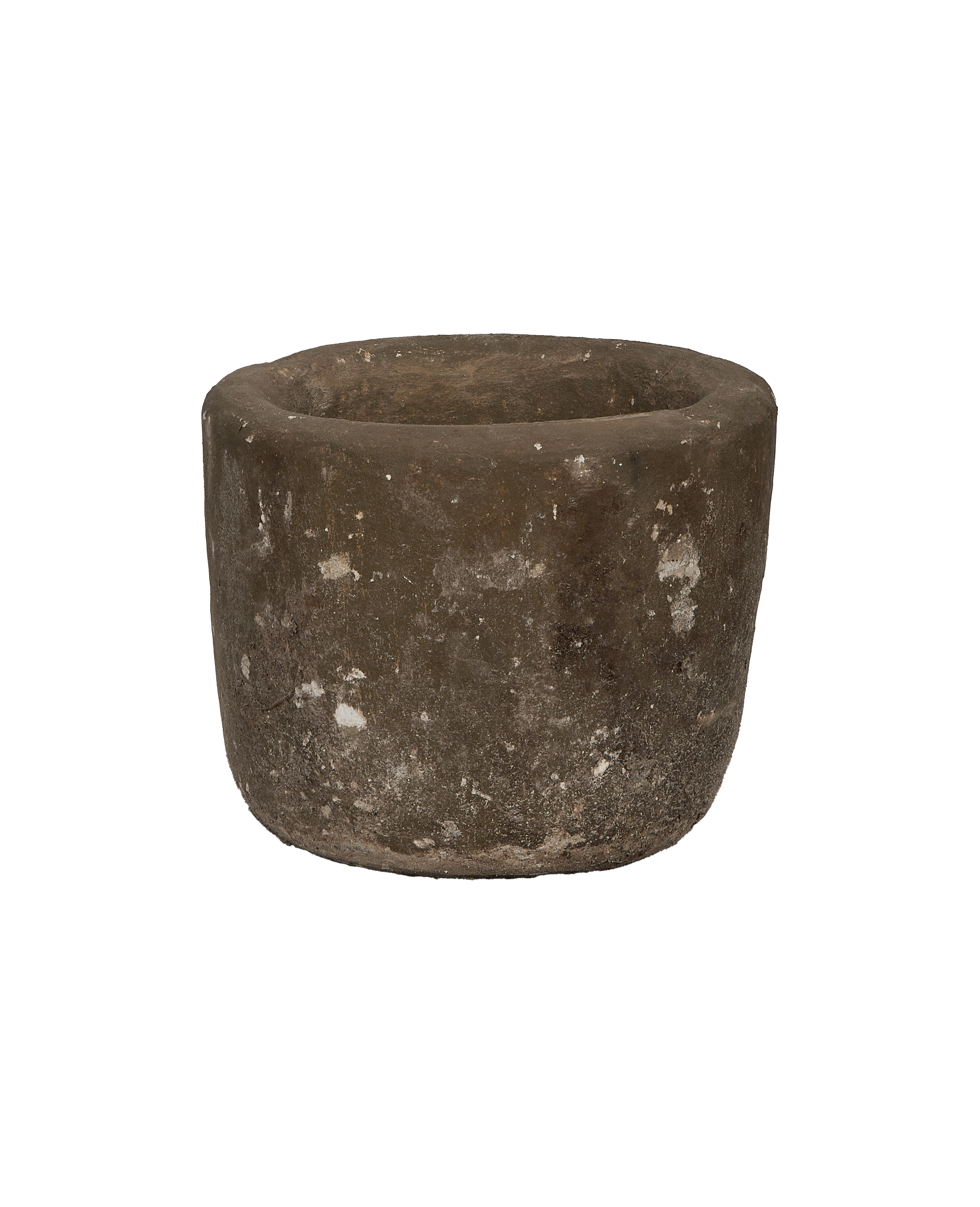 Vintage Indonesian round limestone trough, showing weathered texture from an elevated angle.