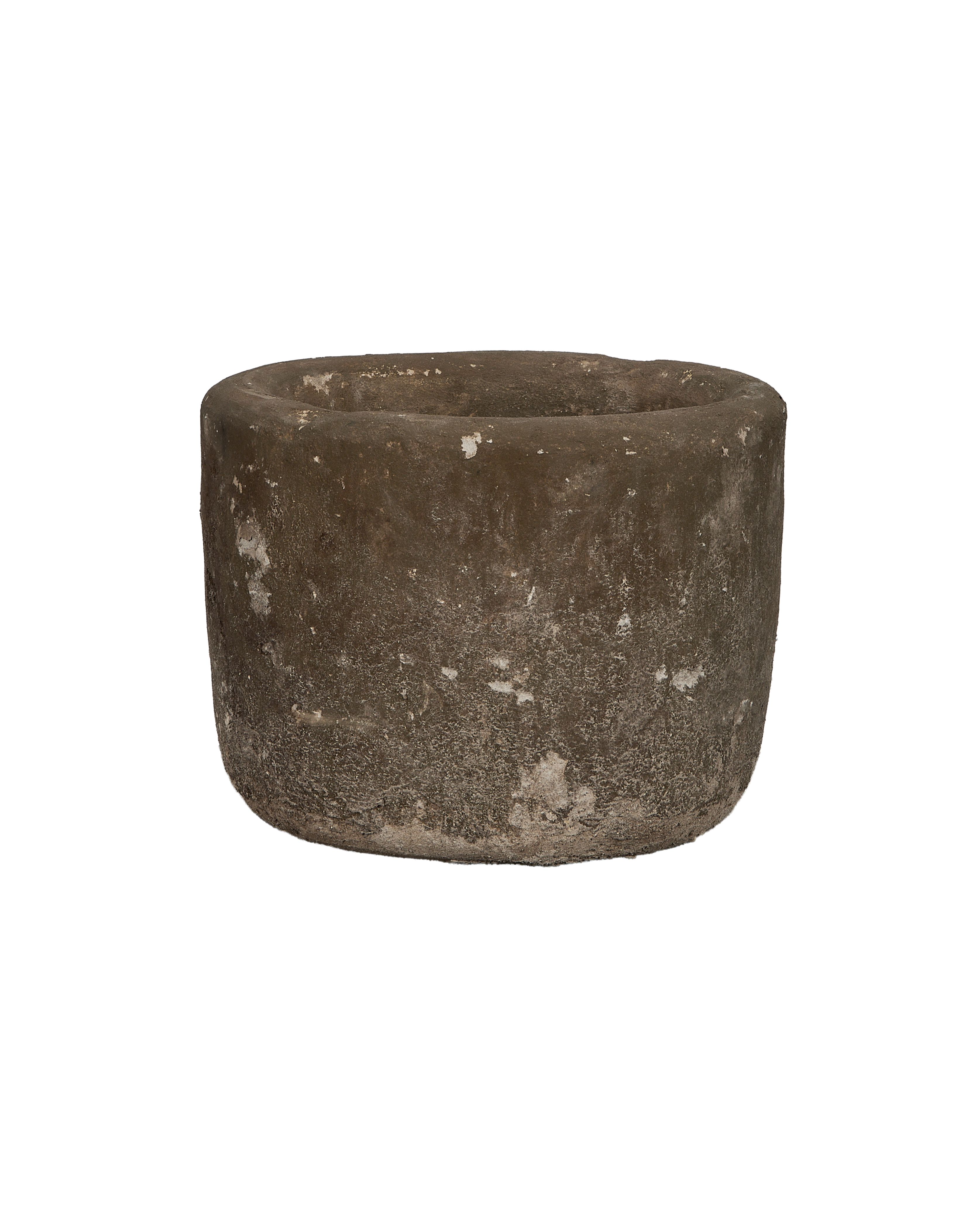 Vintage round Indonesian limestone trough, showing weathered texture from a slightly elevated side view.