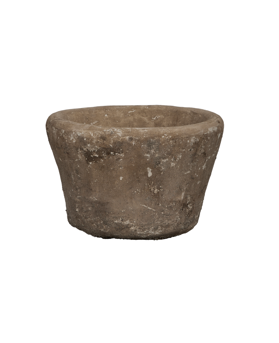 Vintage Indonesian limestone trough, close-up texture, weathered surface, round shape, aged condition.