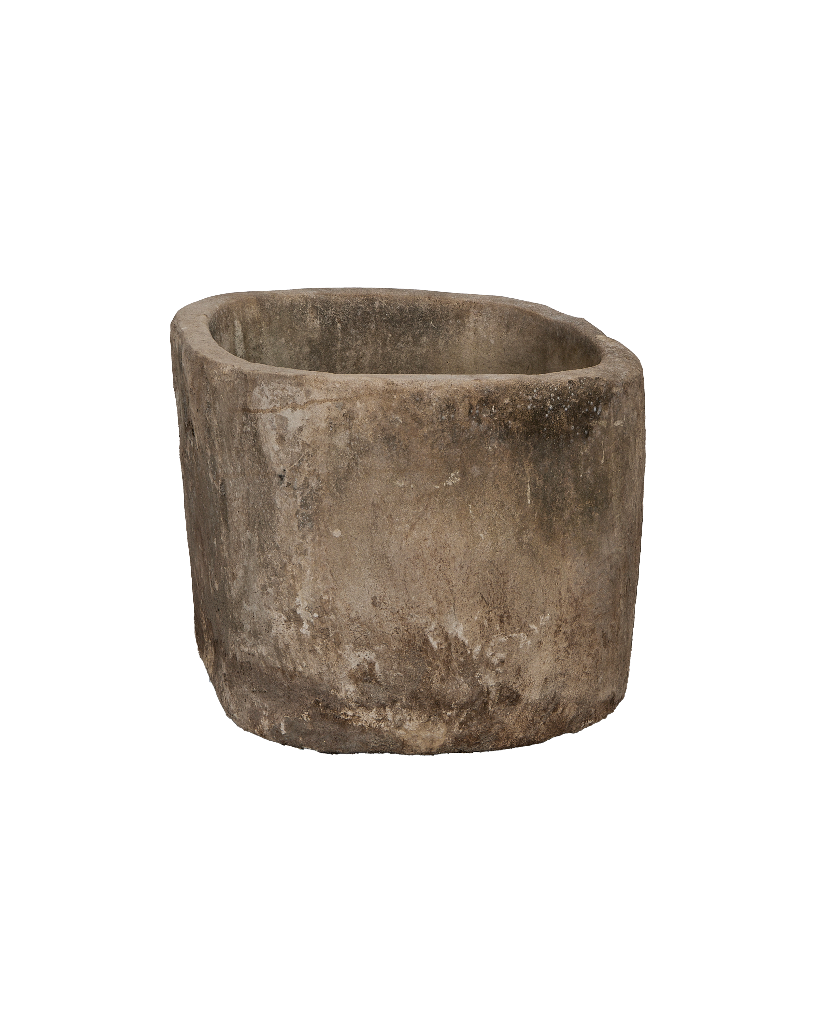 Vintage Indonesian limestone trough viewed from the side, showcasing its weathered, rustic texture.