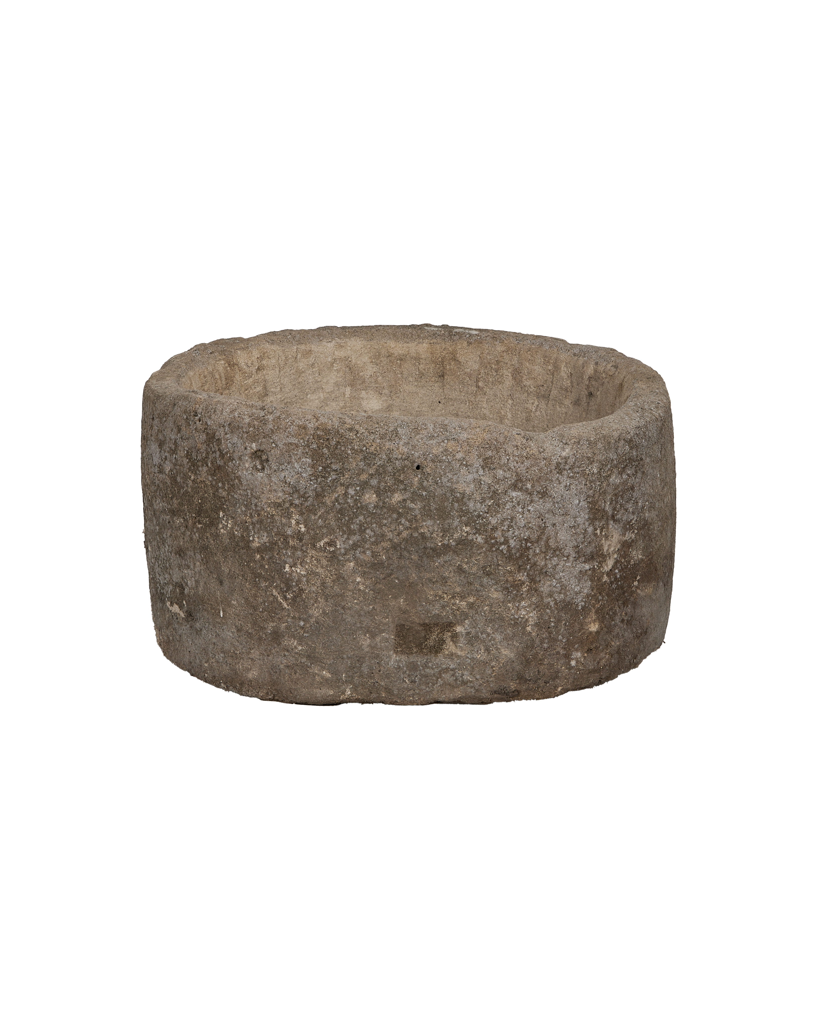 Vintage Indonesian round limestone trough, showing rough exterior texture and rim details.