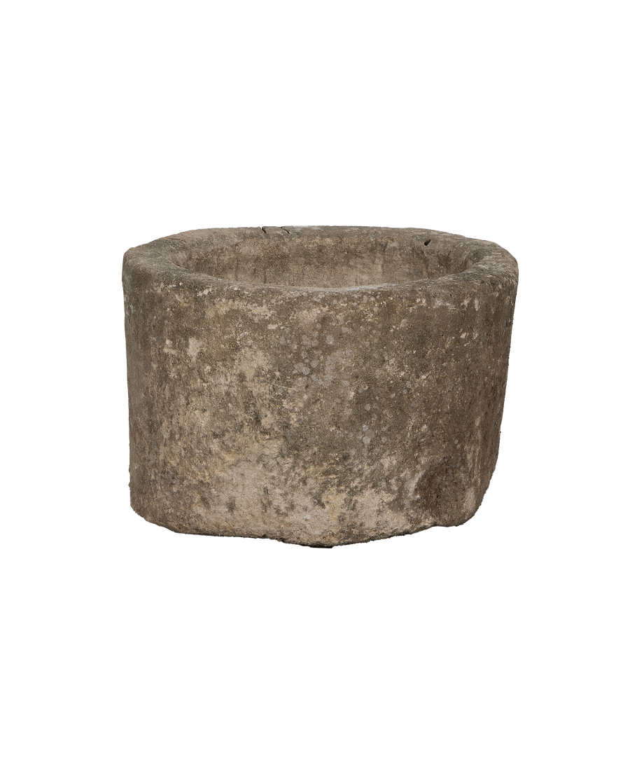 Vintage round Indonesian limestone trough, showing weathered texture and natural imperfections from above.