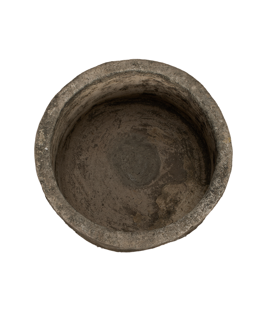 Vintage Indonesian round limestone trough, top-down view showing interior texture.
