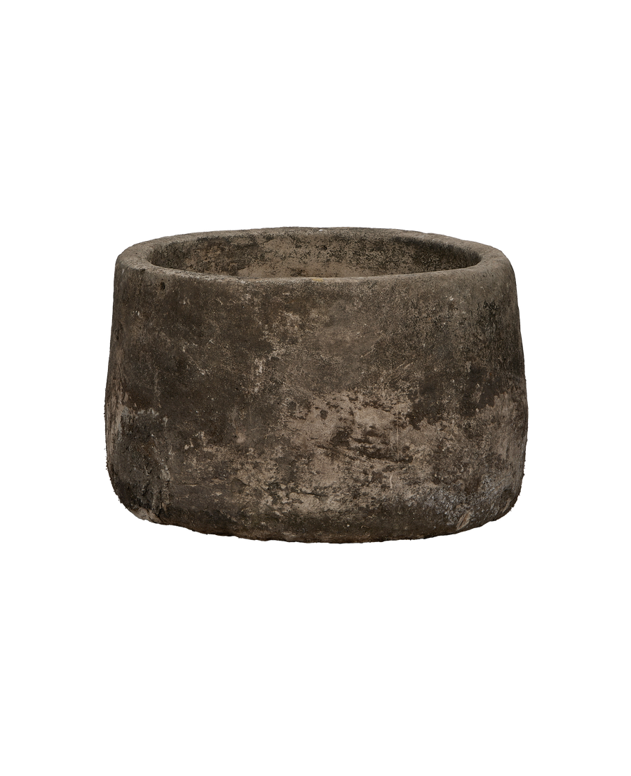 Vintage Indonesian round limestone trough, showing weathered texture from an overhead angle.