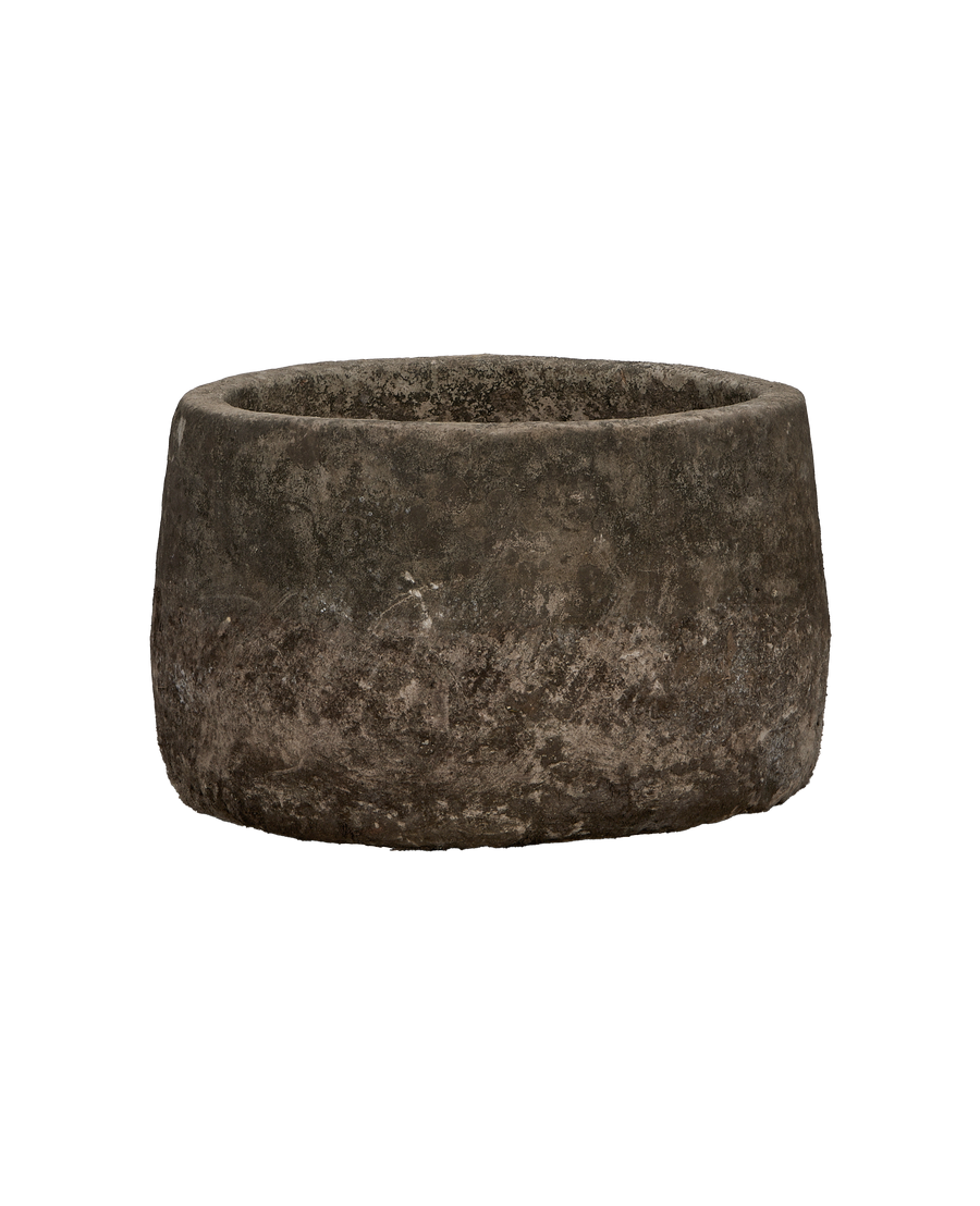 Vintage round Indonesian oak limestone trough, showing weathered texture from top-down perspective.