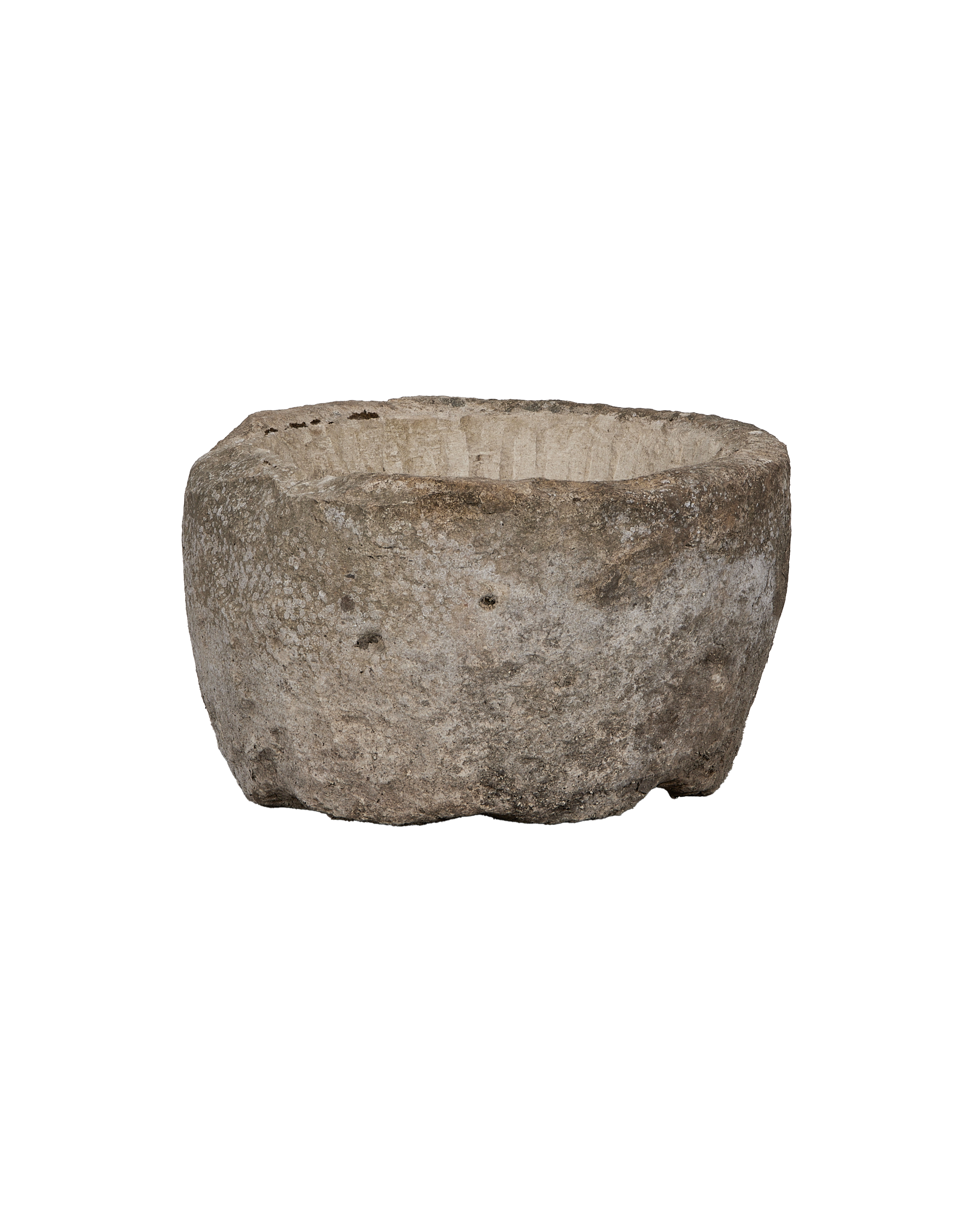 Vintage Indonesian oblong limestone trough viewed from the side, showing weathered texture.