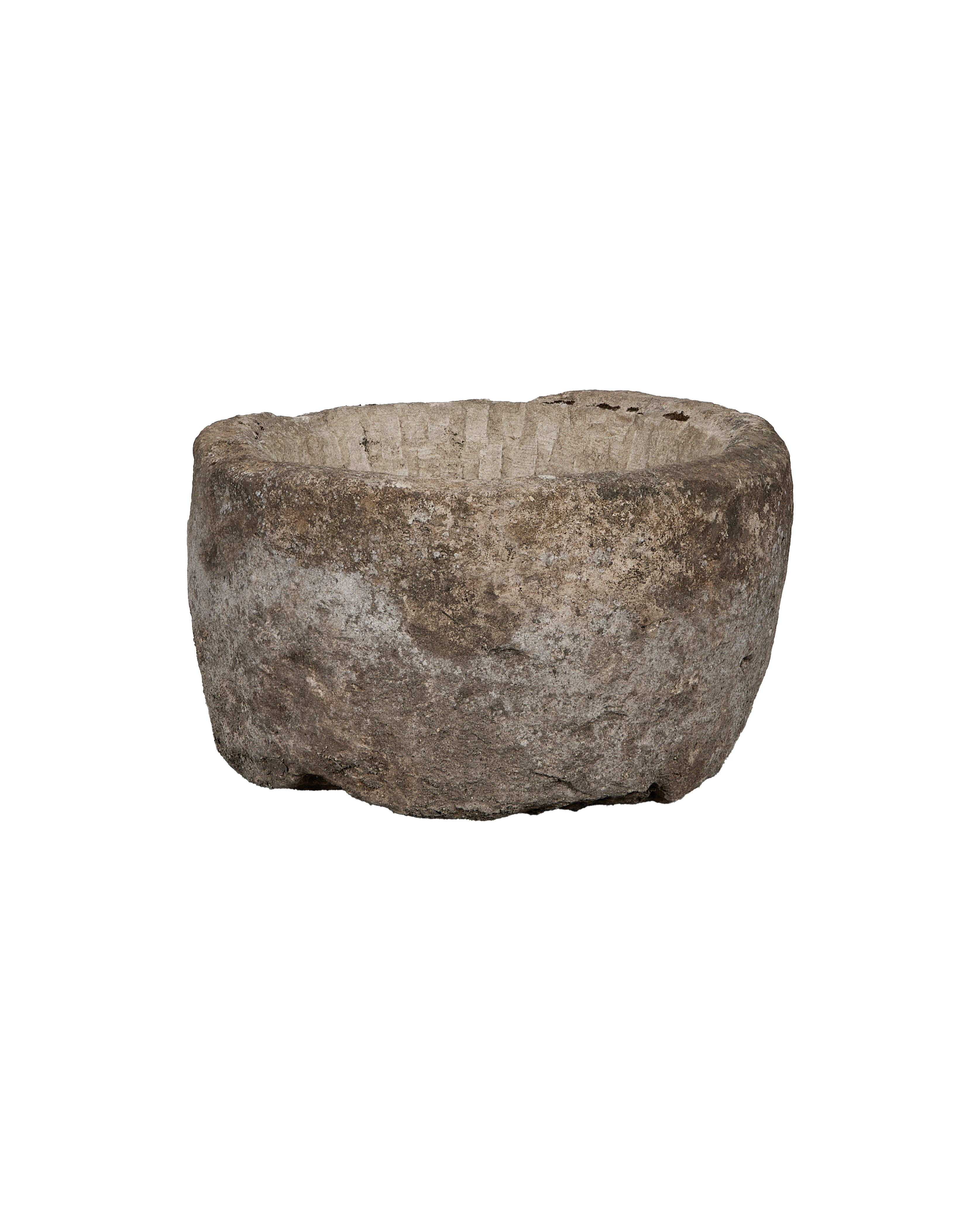 Vintage oblong limestone trough from Indonesia, viewed from side, highlighting weathered texture.