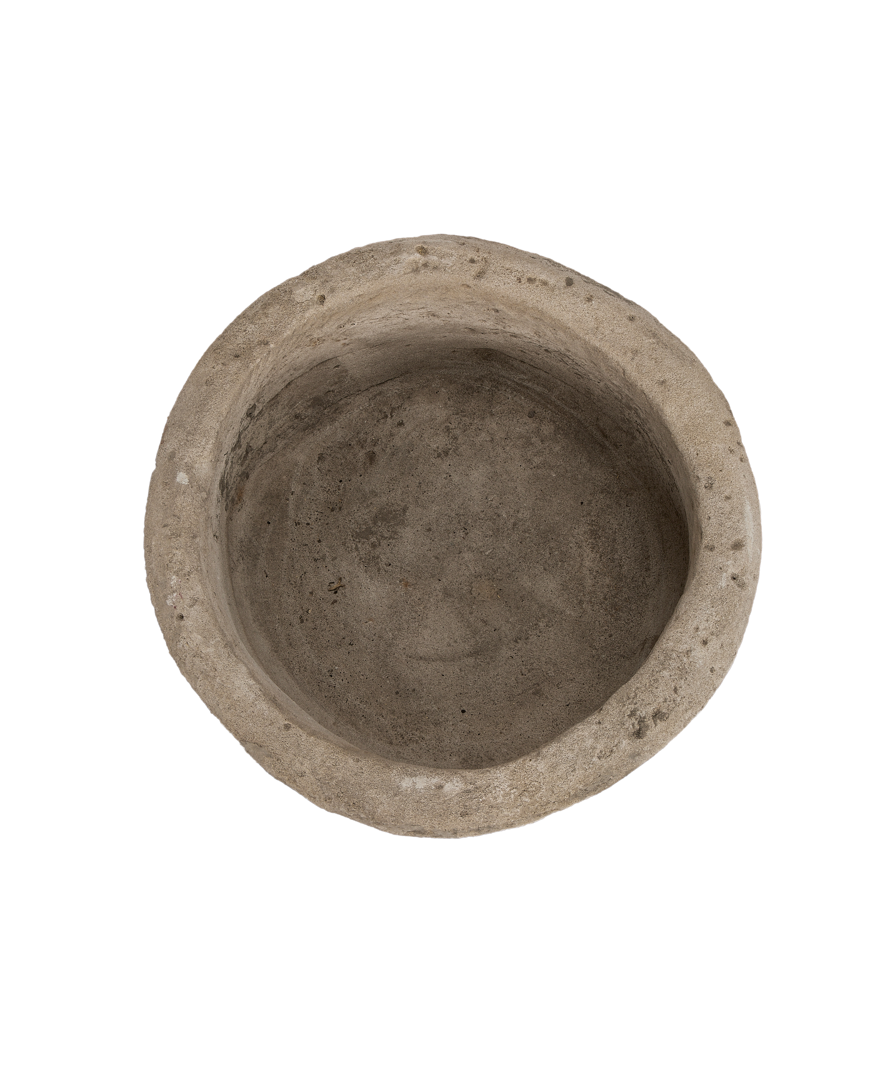 Top-down view of the vintage Indonesian round limestone trough's aged interior.