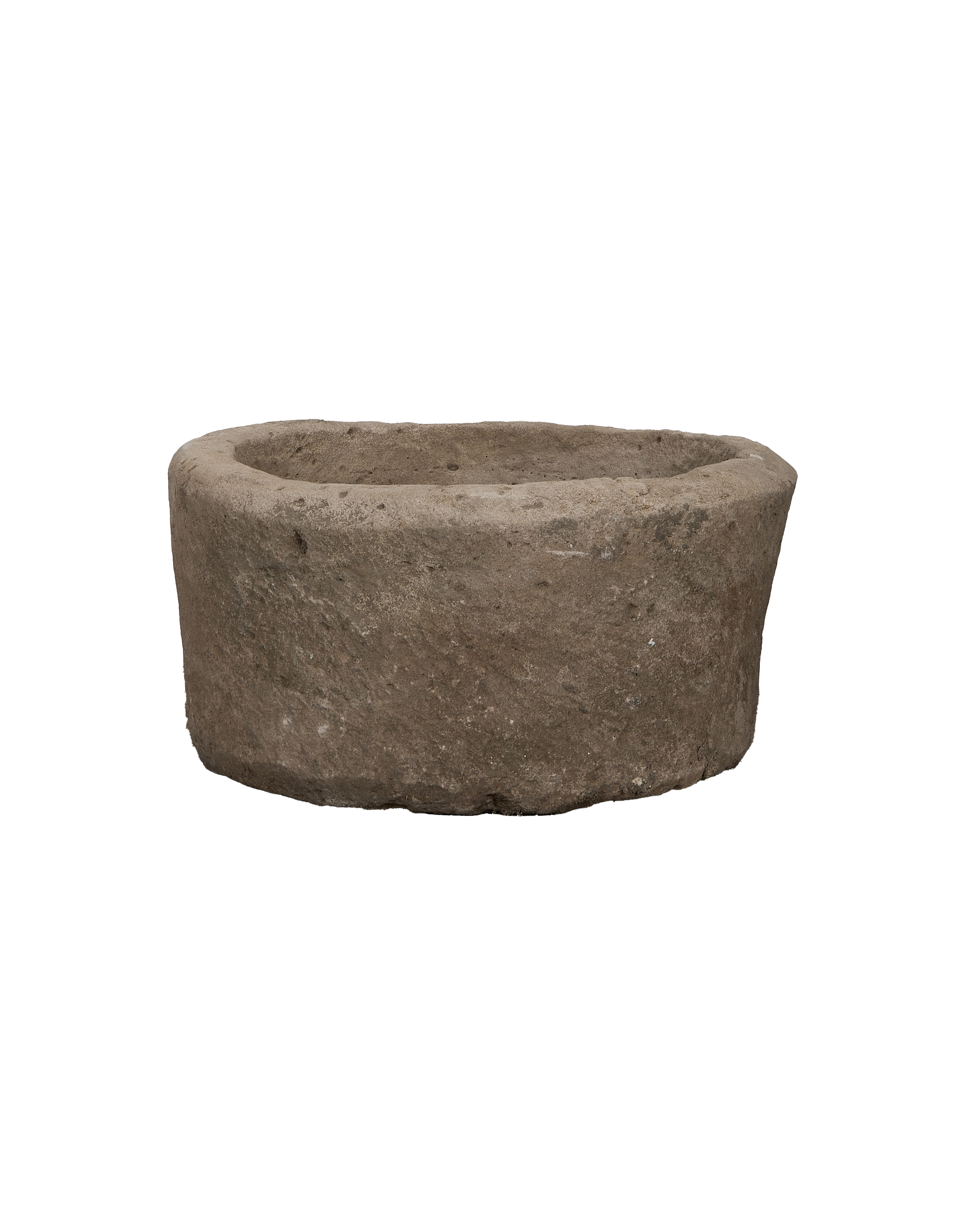 Vintage limestone round trough from Indonesia with textured, weathered natural stone surface.