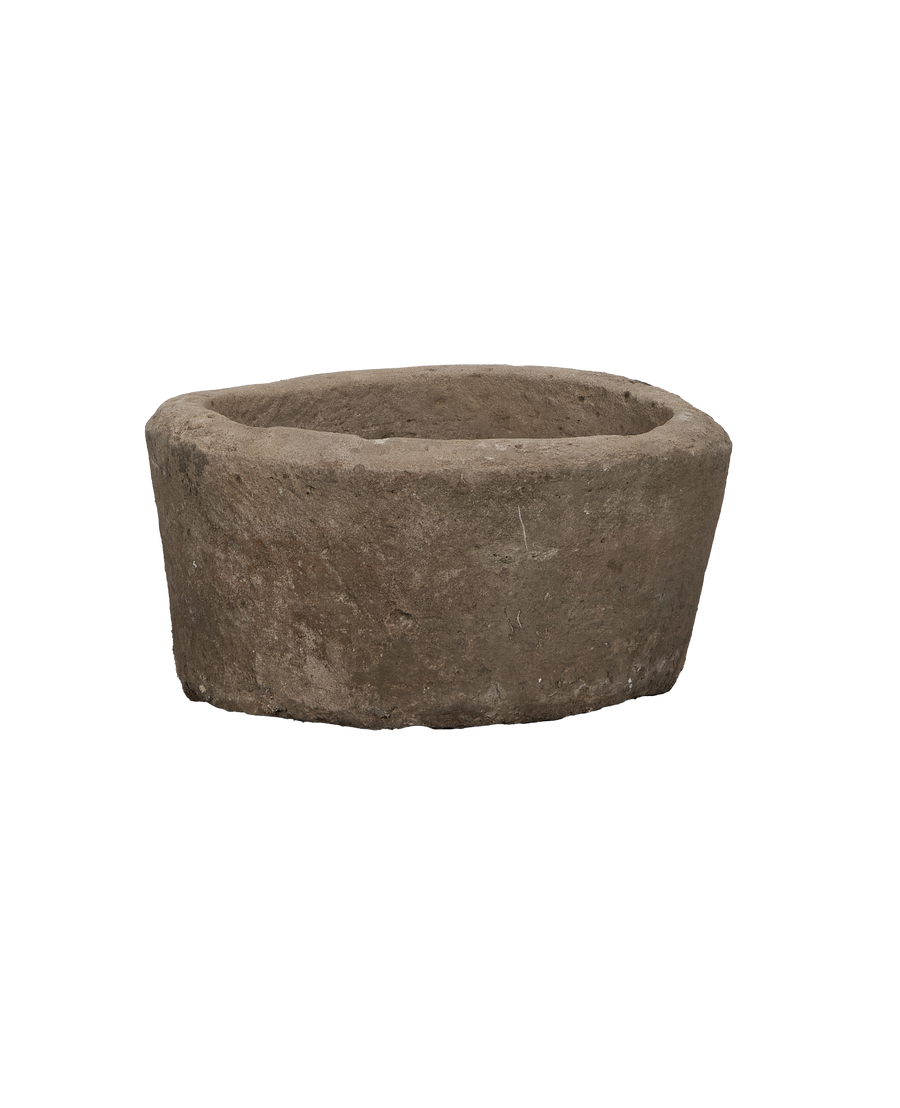 Vintage round Indonesian limestone trough, detailed rough natural texture.