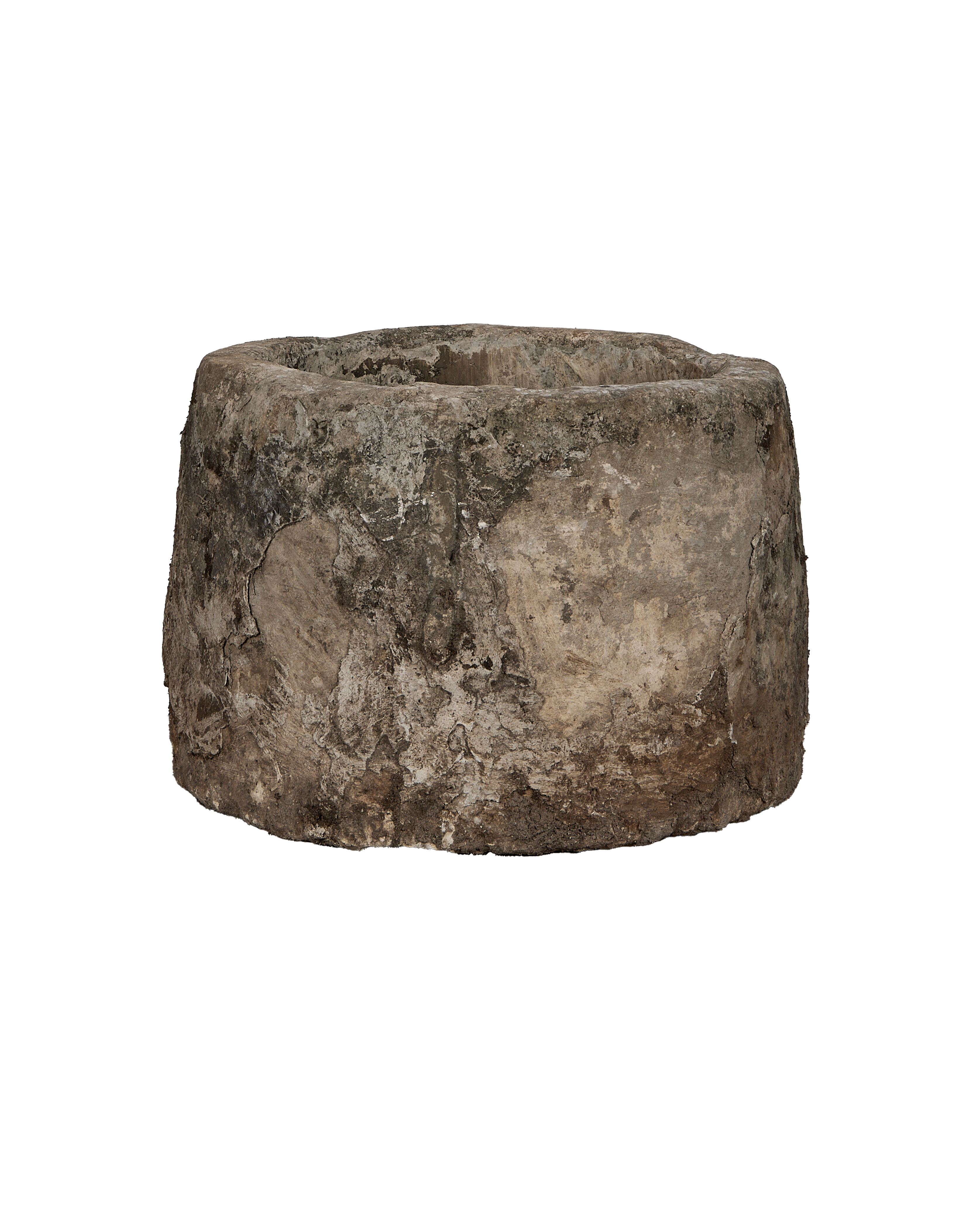 Vintage Indonesian limestone trough, round, showcasing rough, weathered texture from a lower angle.