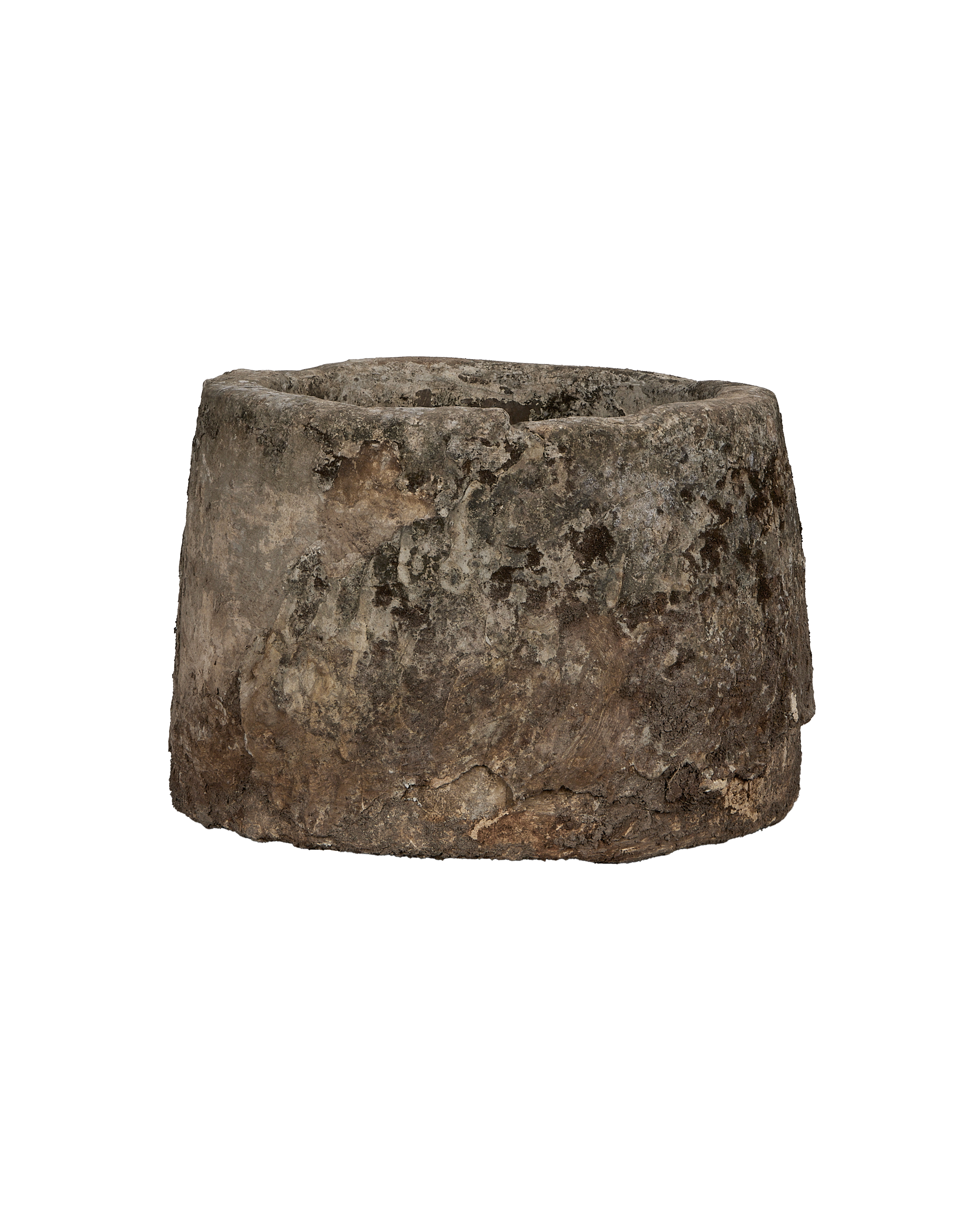 Vintage Indonesian limestone trough, round, showing detailed weathered surface texture, side view.