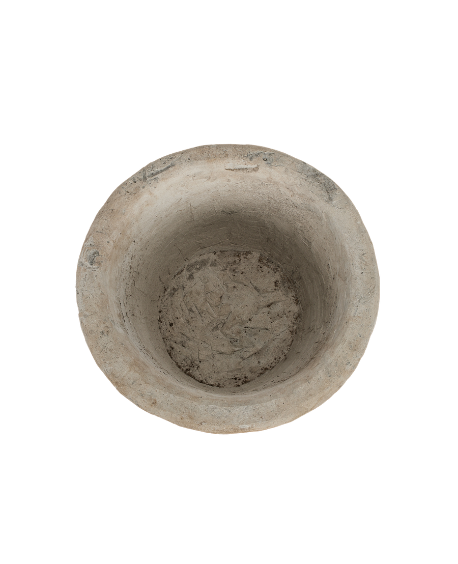 Vintage Indonesian round oak limestone trough, top-down view showing interior texture.