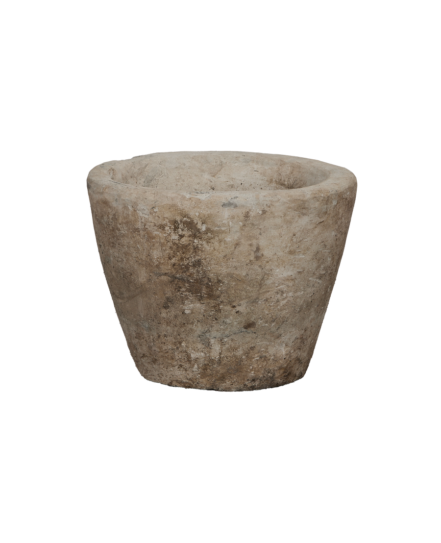 Vintage Indonesian round limestone trough, full side view emphasizing weathered texture.