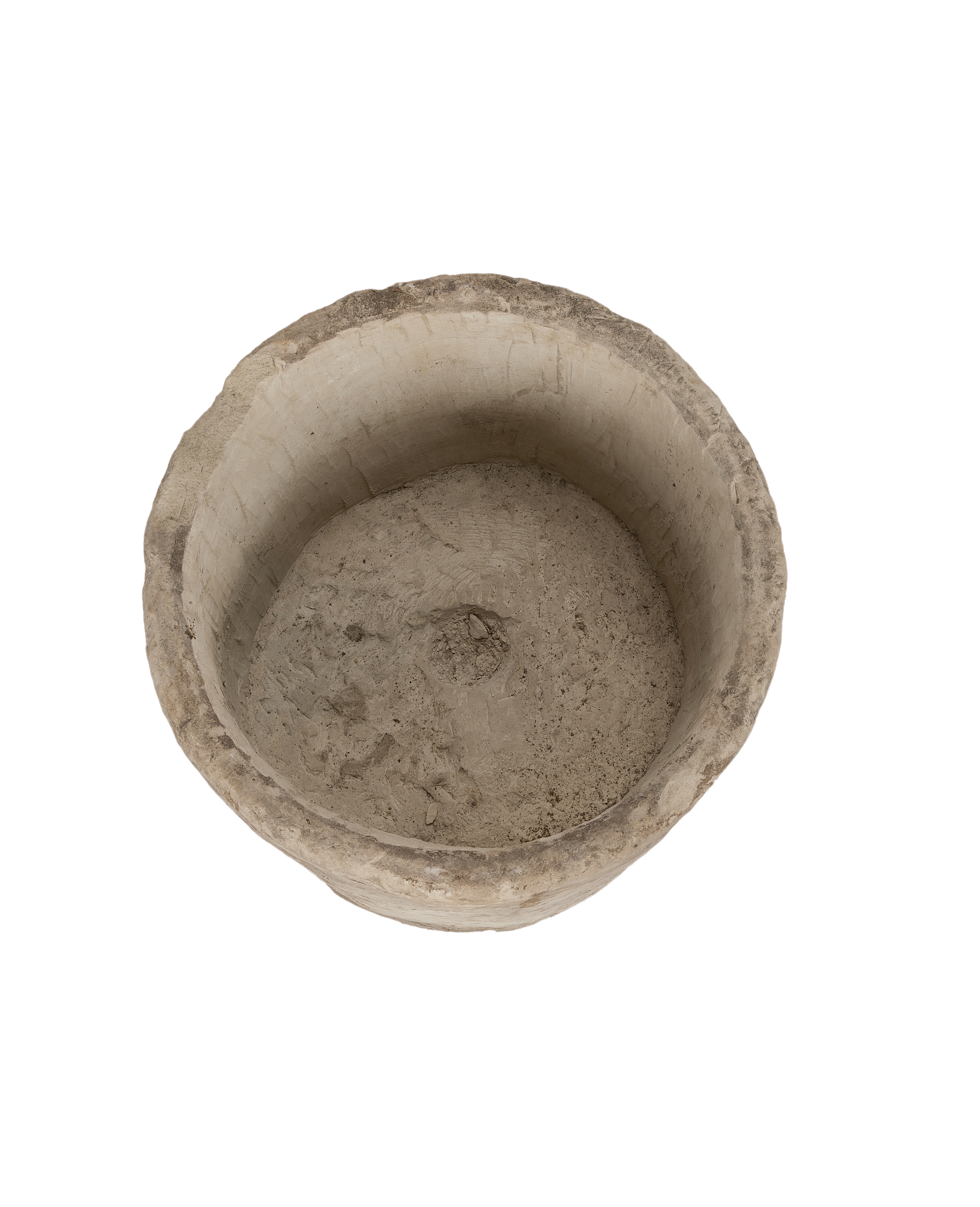 Vintage Indonesian round limestone trough, top-down view showing interior texture and drainage hole.