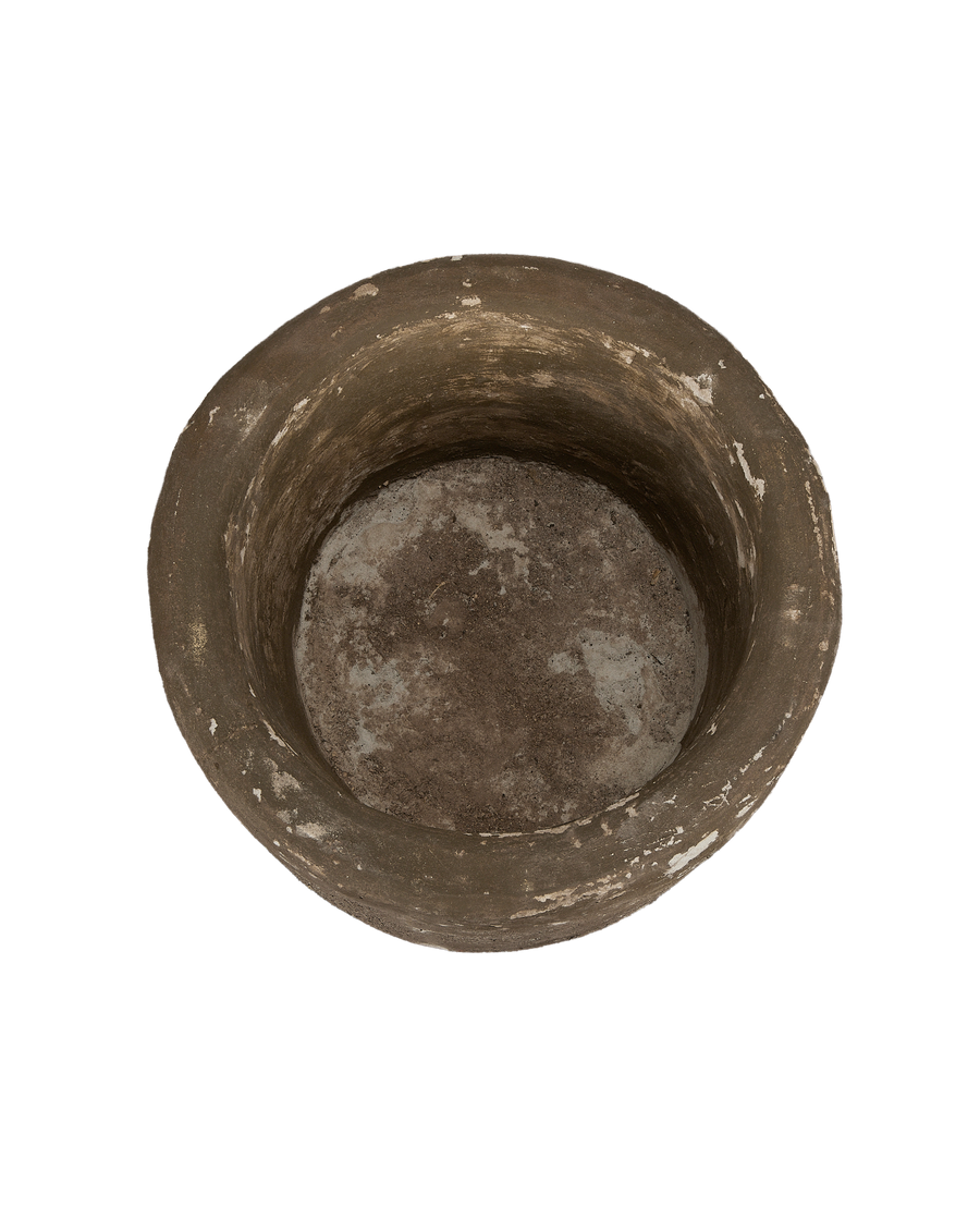 Vintage round Indonesian limestone trough, top-down view showing interior and worn texture.