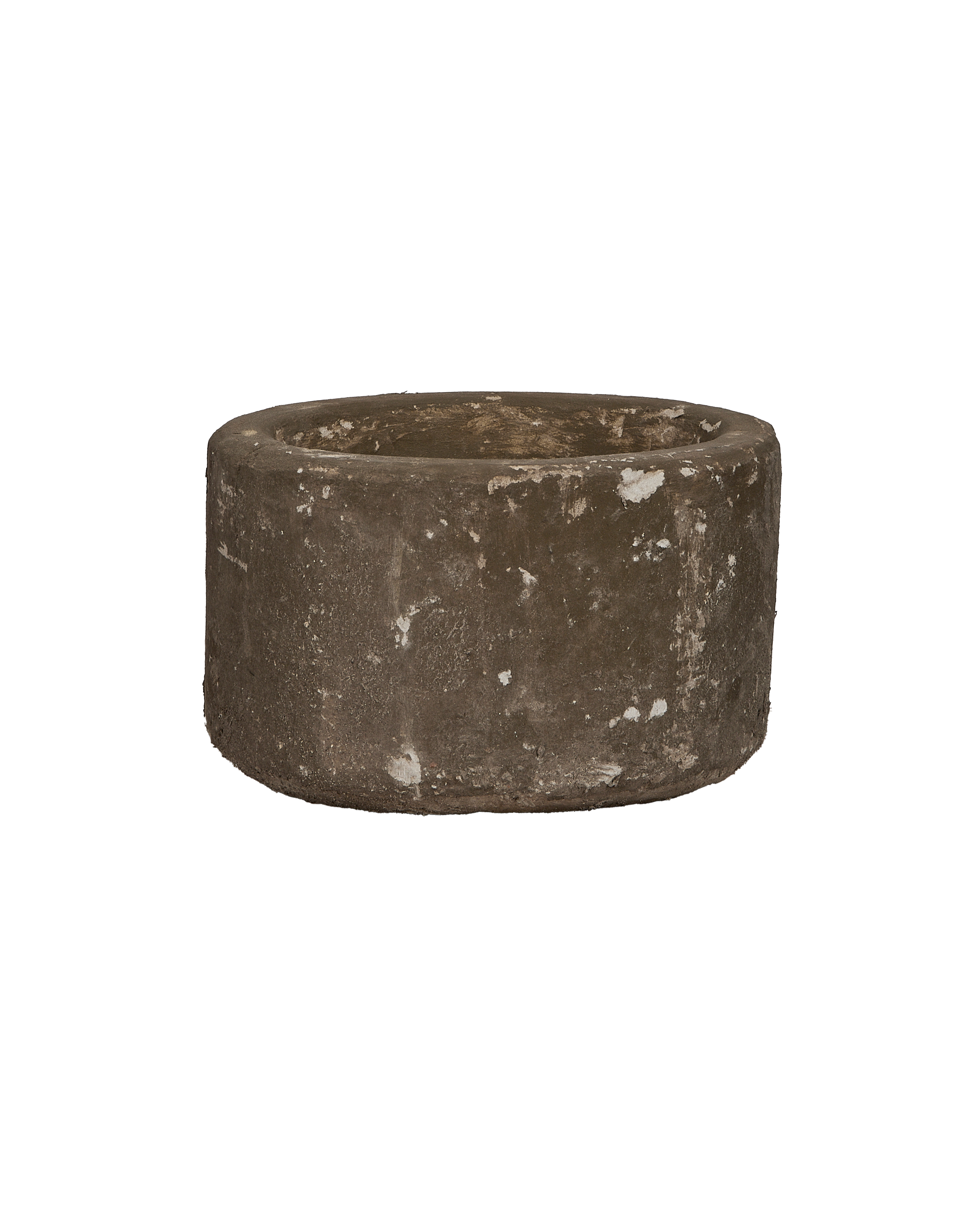 Round vintage limestone trough, close-up of textured exterior with weathered white and gray patina.