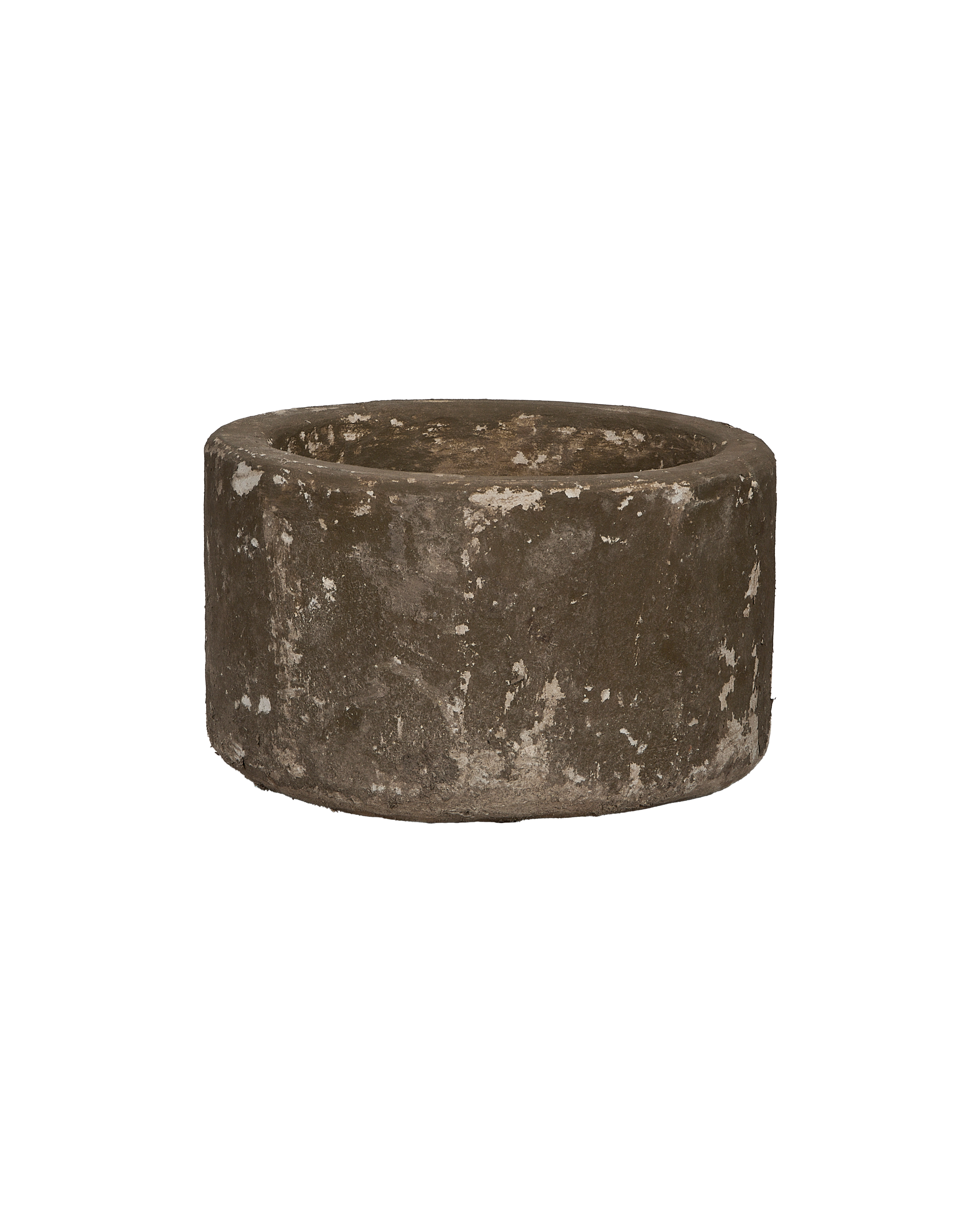 Vintage Indonesian round limestone trough, showing weathered texture and natural imperfections, slightly angled view.