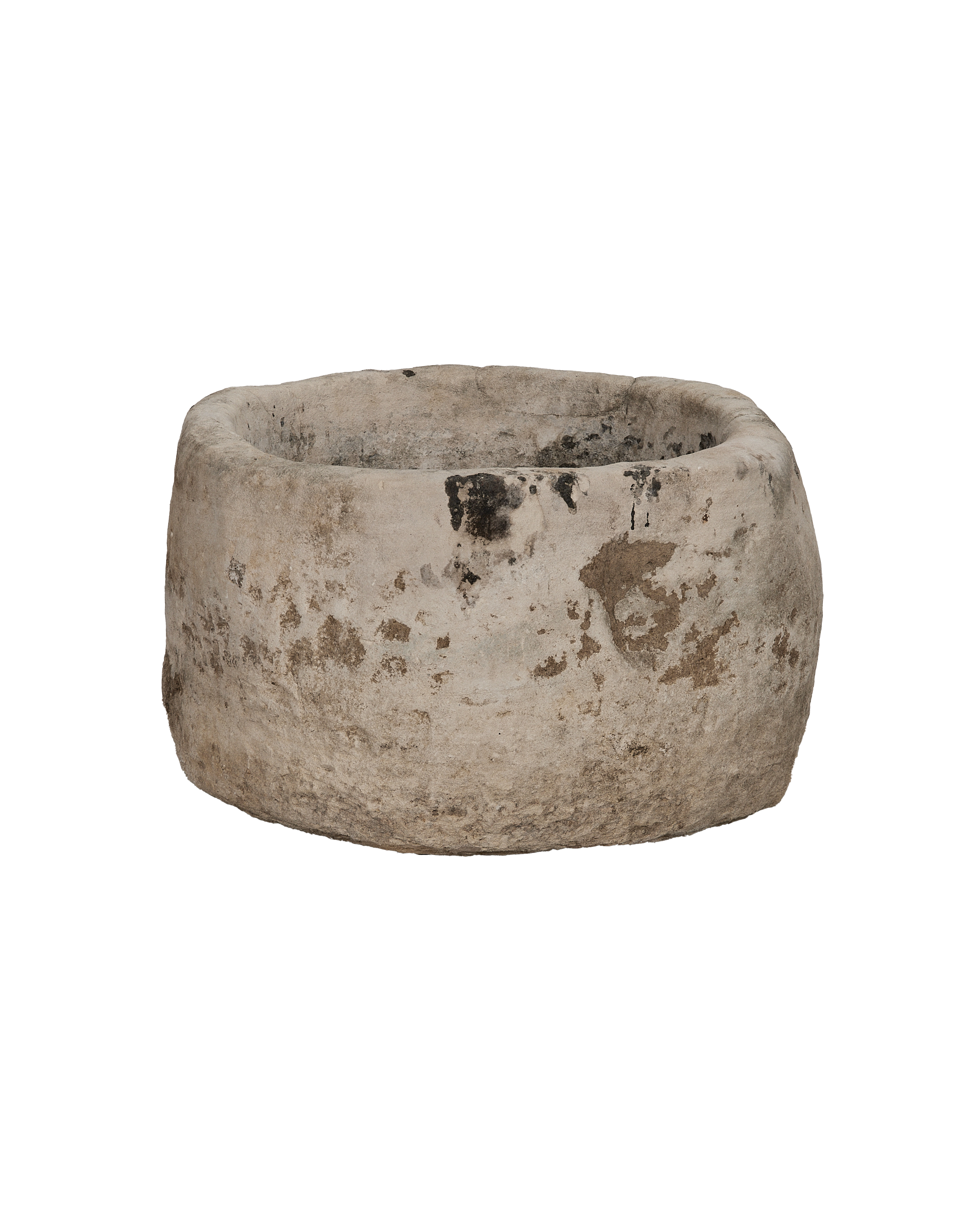 Vintage round limestone trough, showing eroded texture and dark patina, from Indonesia.