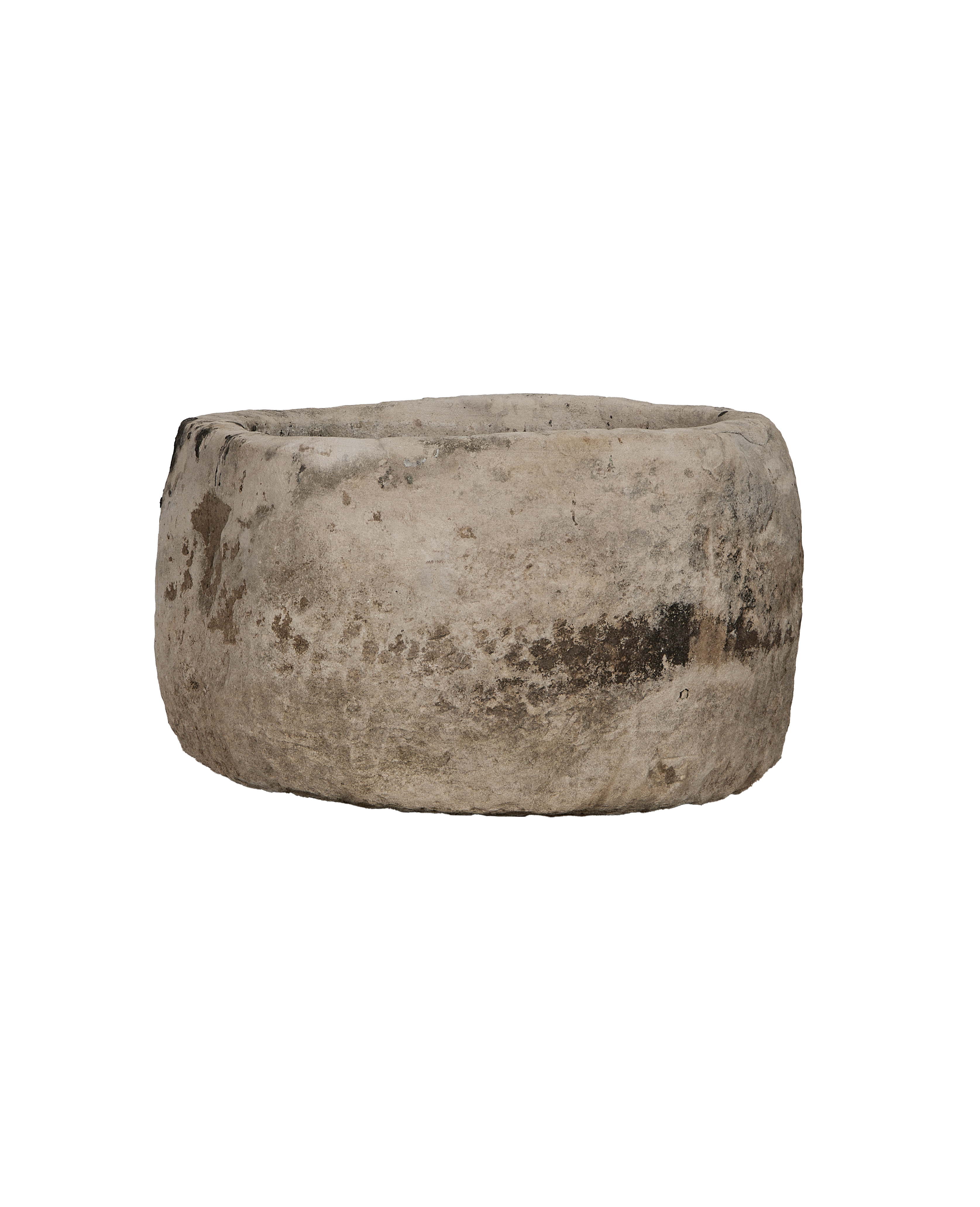 Vintage Indonesian round limestone trough, showing weathered texture from front angle.
