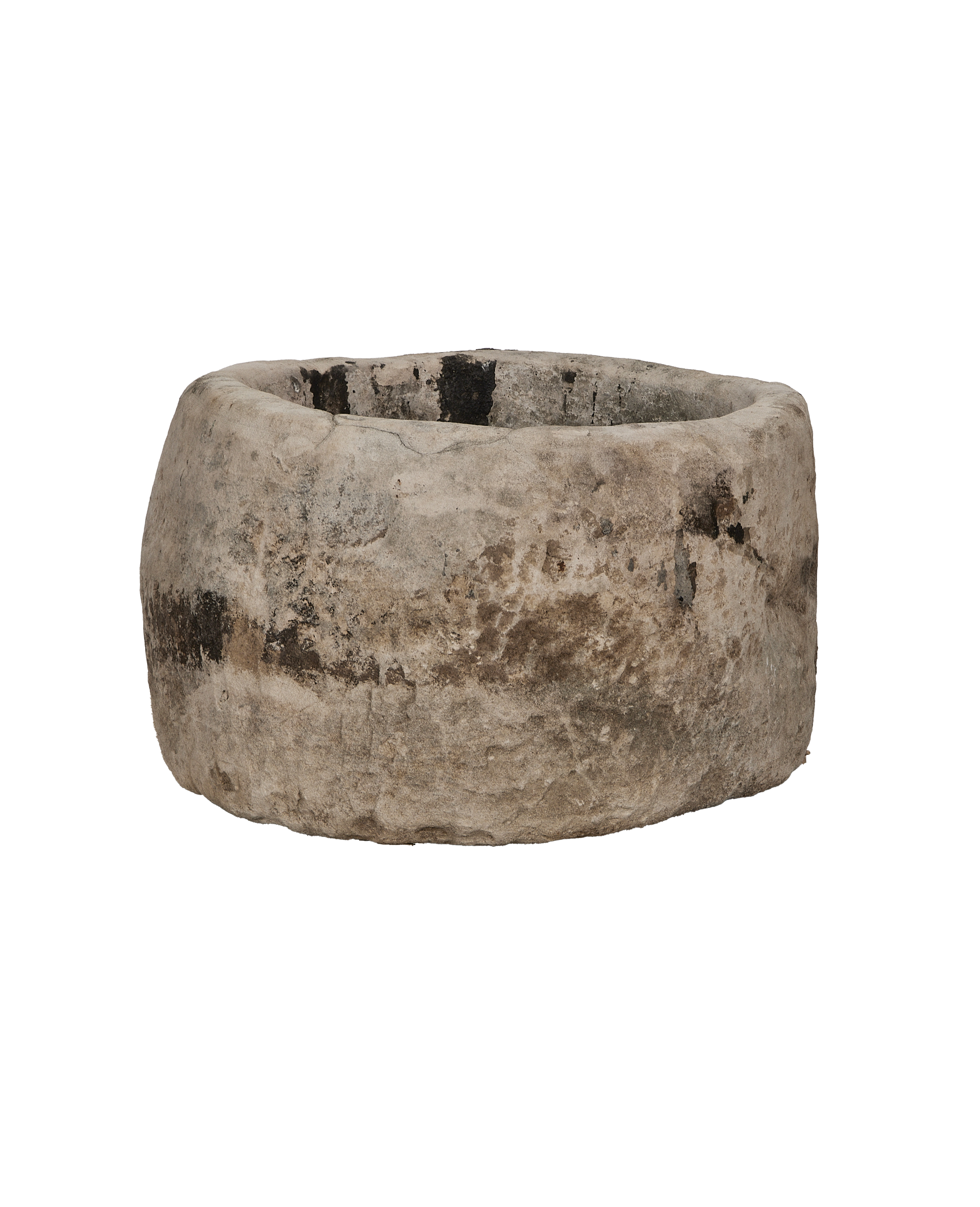 Vintage Indonesian round limestone trough, naturally weathered with dark stains and visible oak grain.