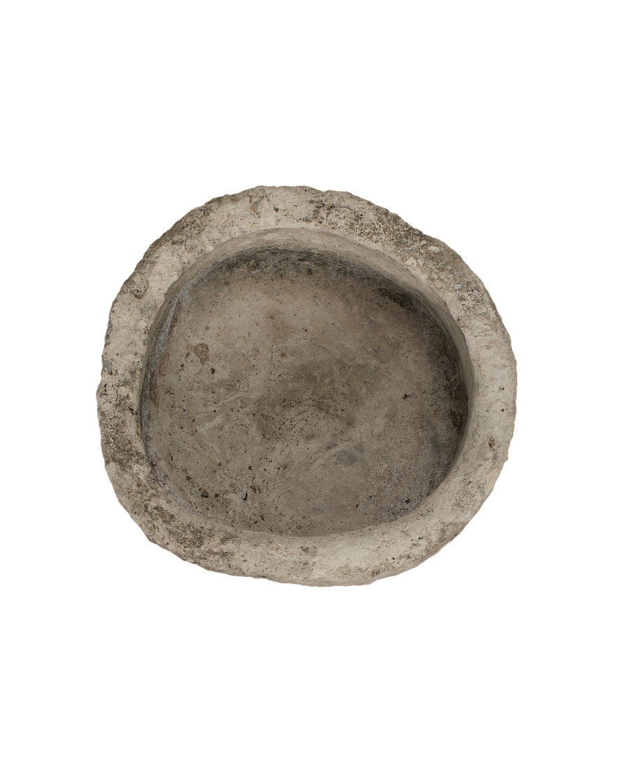 Round limestone trough, vintage, showing weathered texture and aged patina on inner surface.