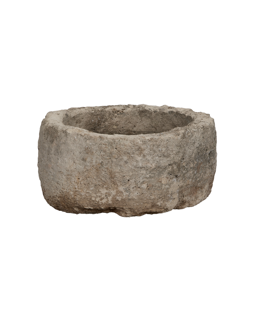 Vintage round limestone trough from Indonesia, showcasing weathered surface texture and interior details.