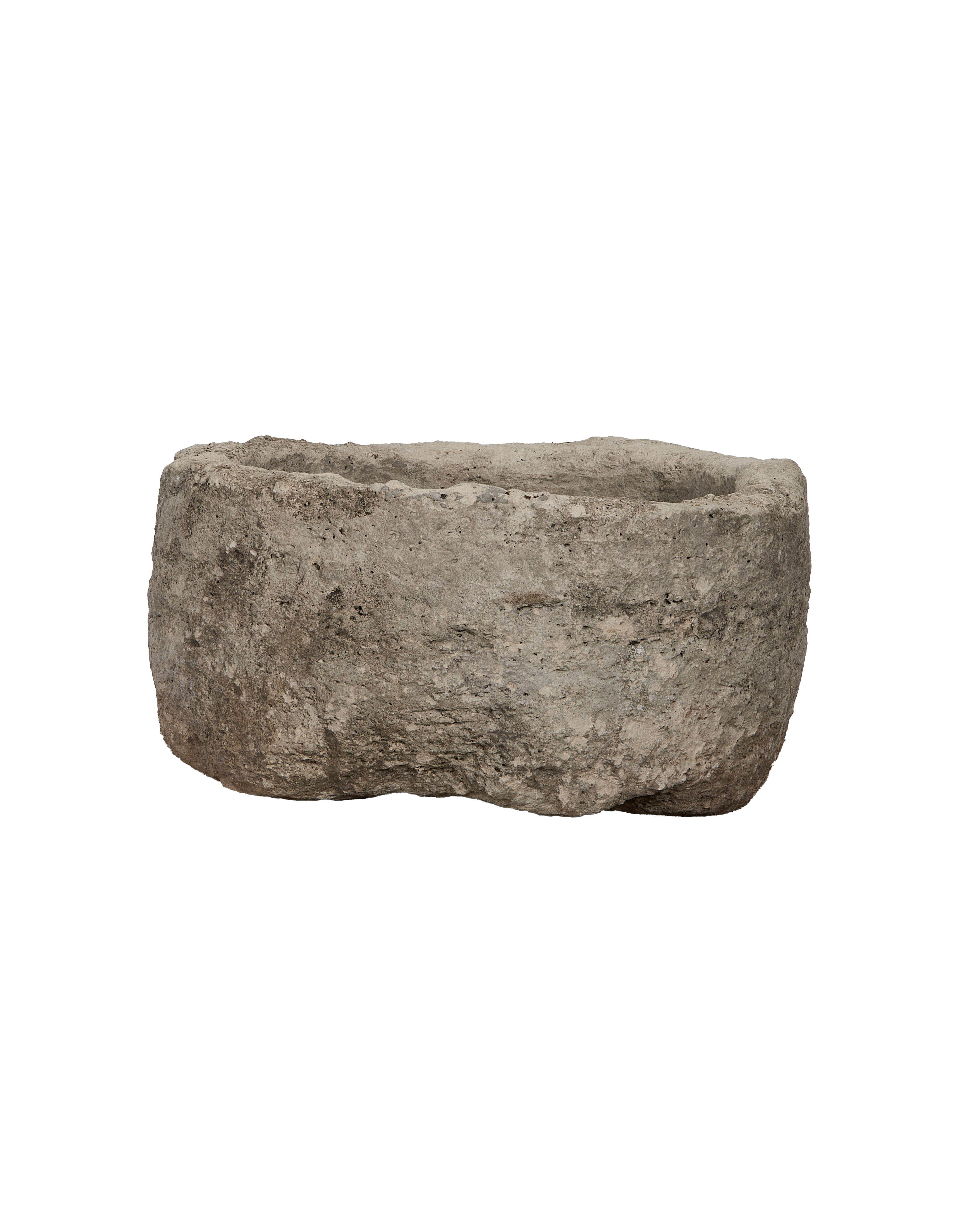 Vintage round limestone trough, side profile showcasing rough texture and natural patinas.