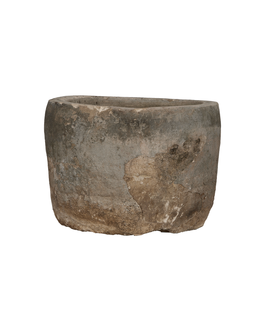 Vintage limestone trough from Indonesia, showing a side view with aged texture and imperfections.