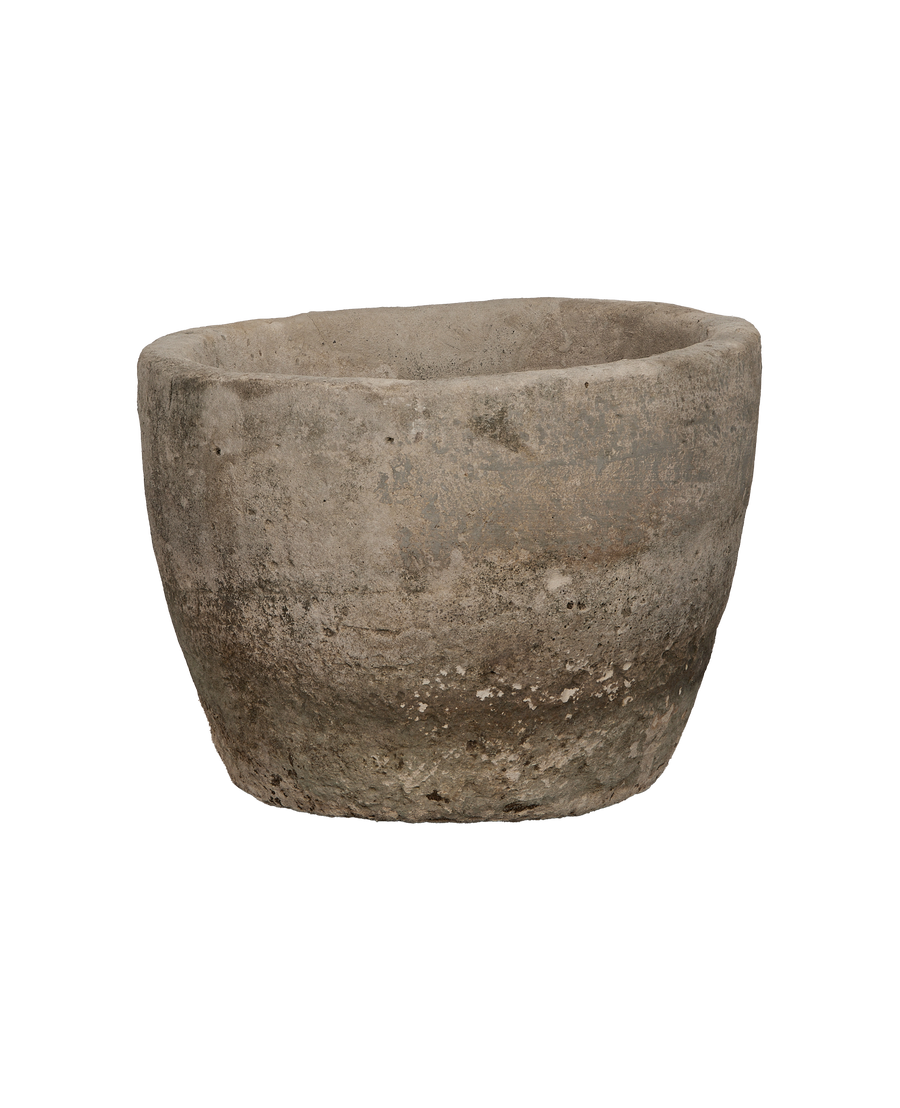 Vintage limestone trough, round, showing detailed side texture and natural aged patina.