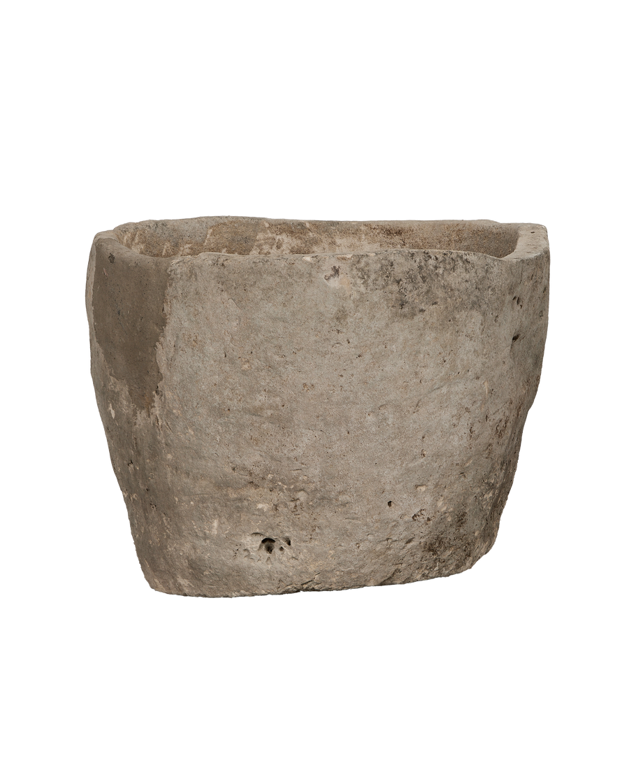Vintage Indonesian limestone trough closeup, showcasing textured surface and naturally weathered patina.