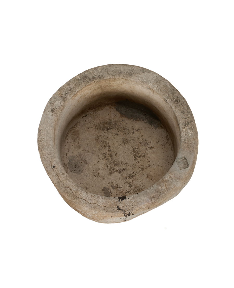 Vintage Indonesian limestone trough viewed from above, showcasing distressed surface and interior texture.