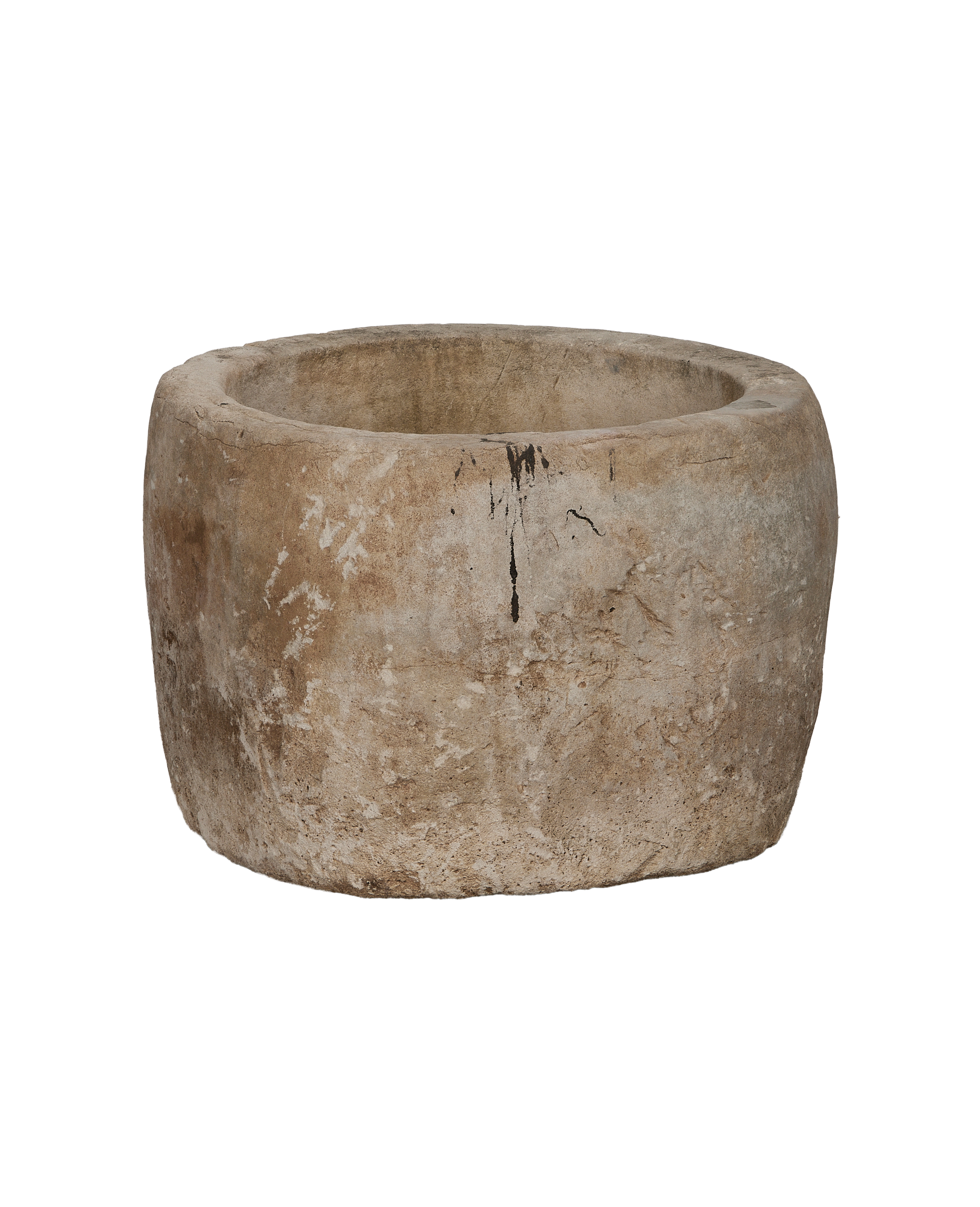 Vintage round limestone trough, rich texture, dark natural markings, Indonesia.
