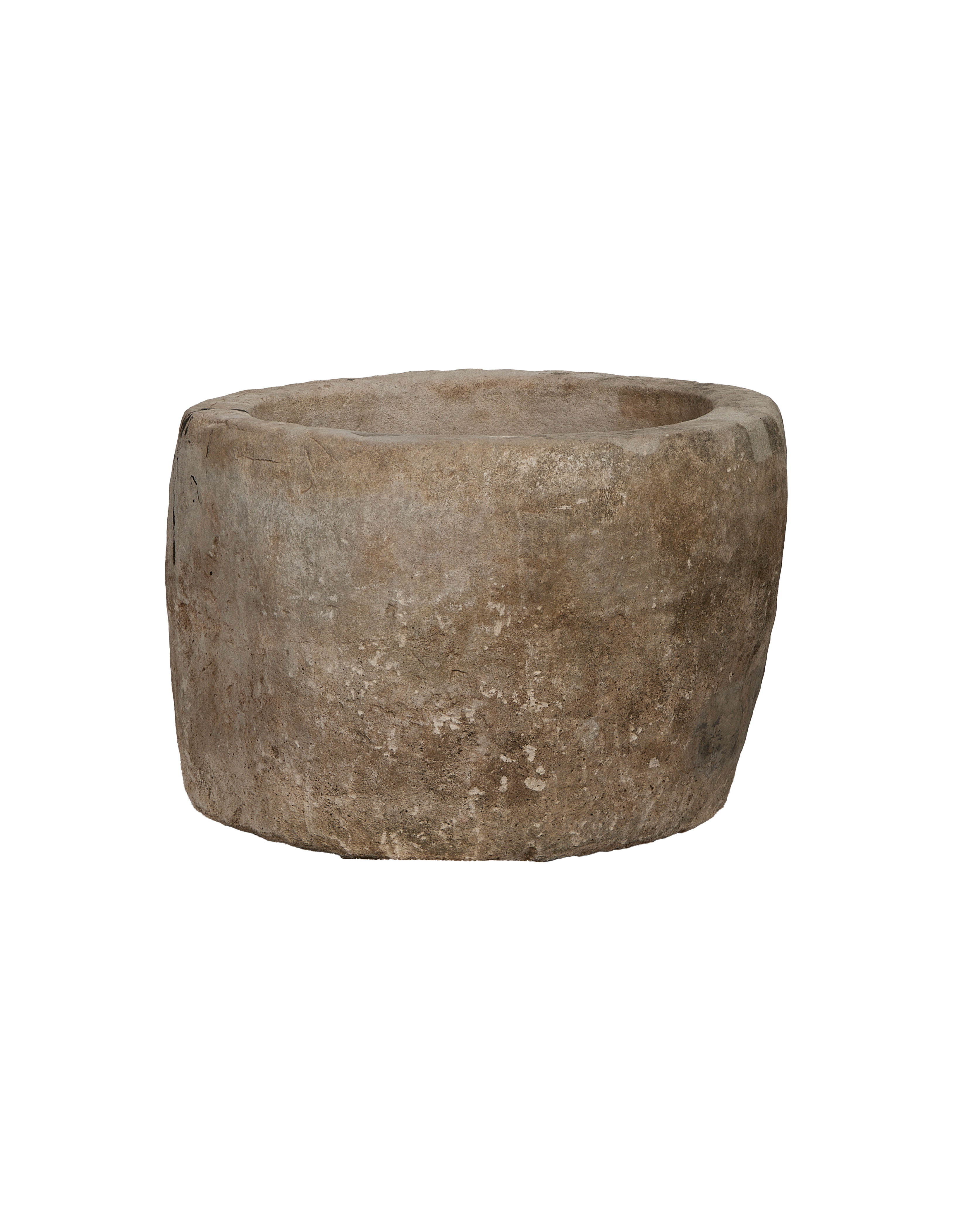 Vintage round limestone trough, aged condition. Close-up of exterior texture. Hand-carved.