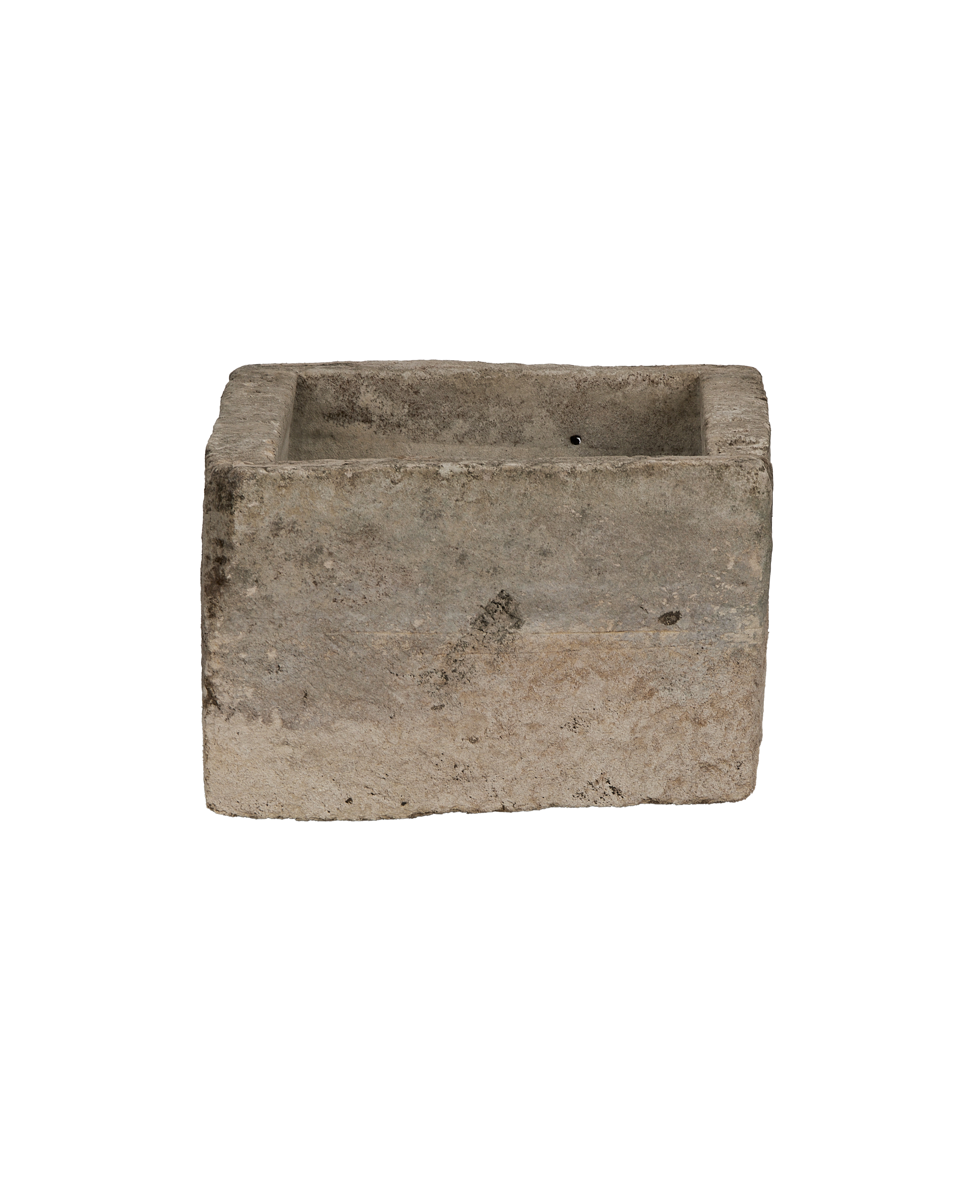 Vintage Indonesian limestone trough, top view with drainage hole visible, ancient character.