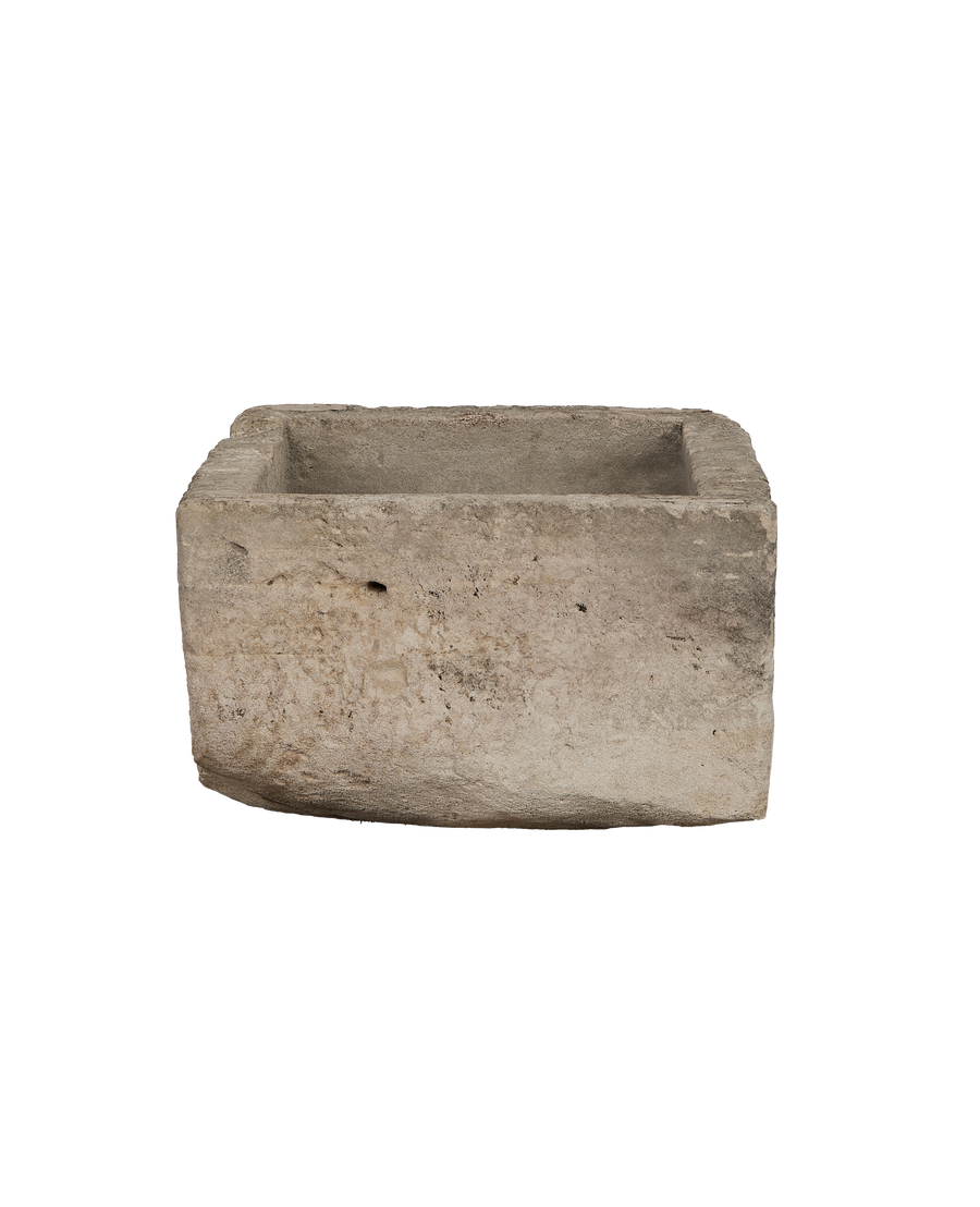 Vintage rectangular limestone trough, showing the rugged, textured exterior and aged patina from Indonesia.