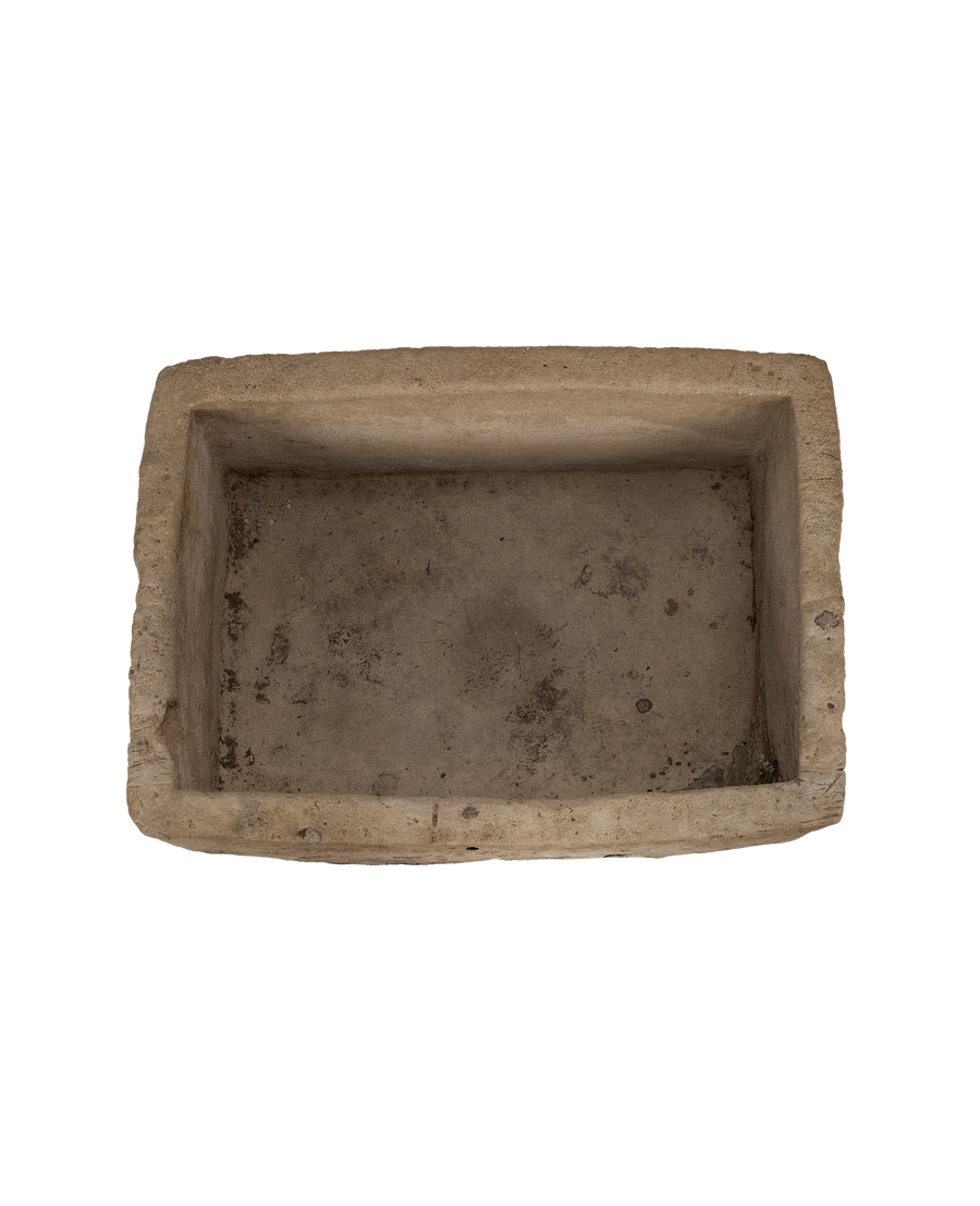 Vintage rectangular limestone trough, overhead view highlighting the textured, worn interior surface.