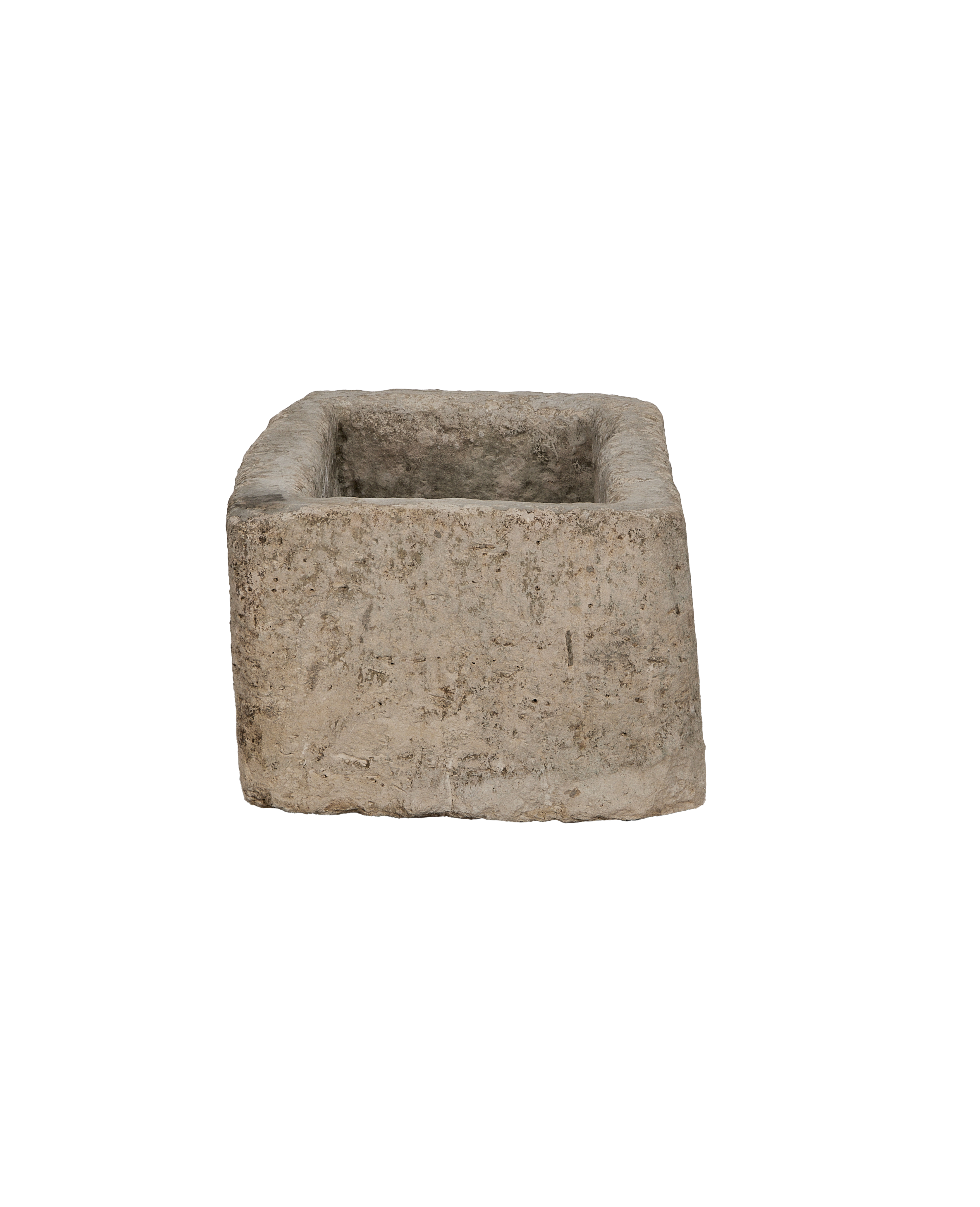 Vintage rectangular limestone trough, showing the rustic, weathered, textured surface from a slightly top-down angle.