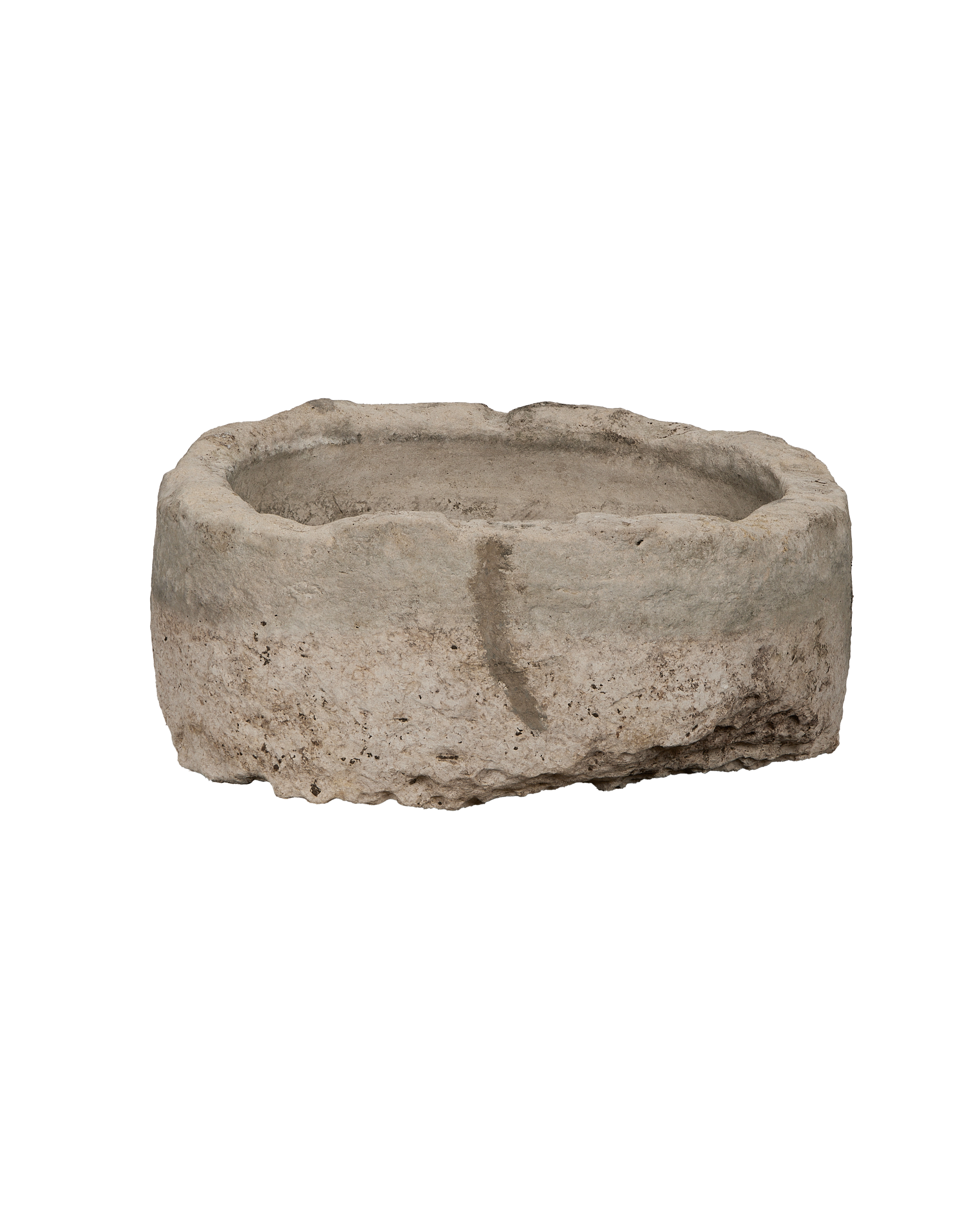Vintage Indonesian oblong limestone trough viewed from the side, showcasing its weathered, rustic texture.