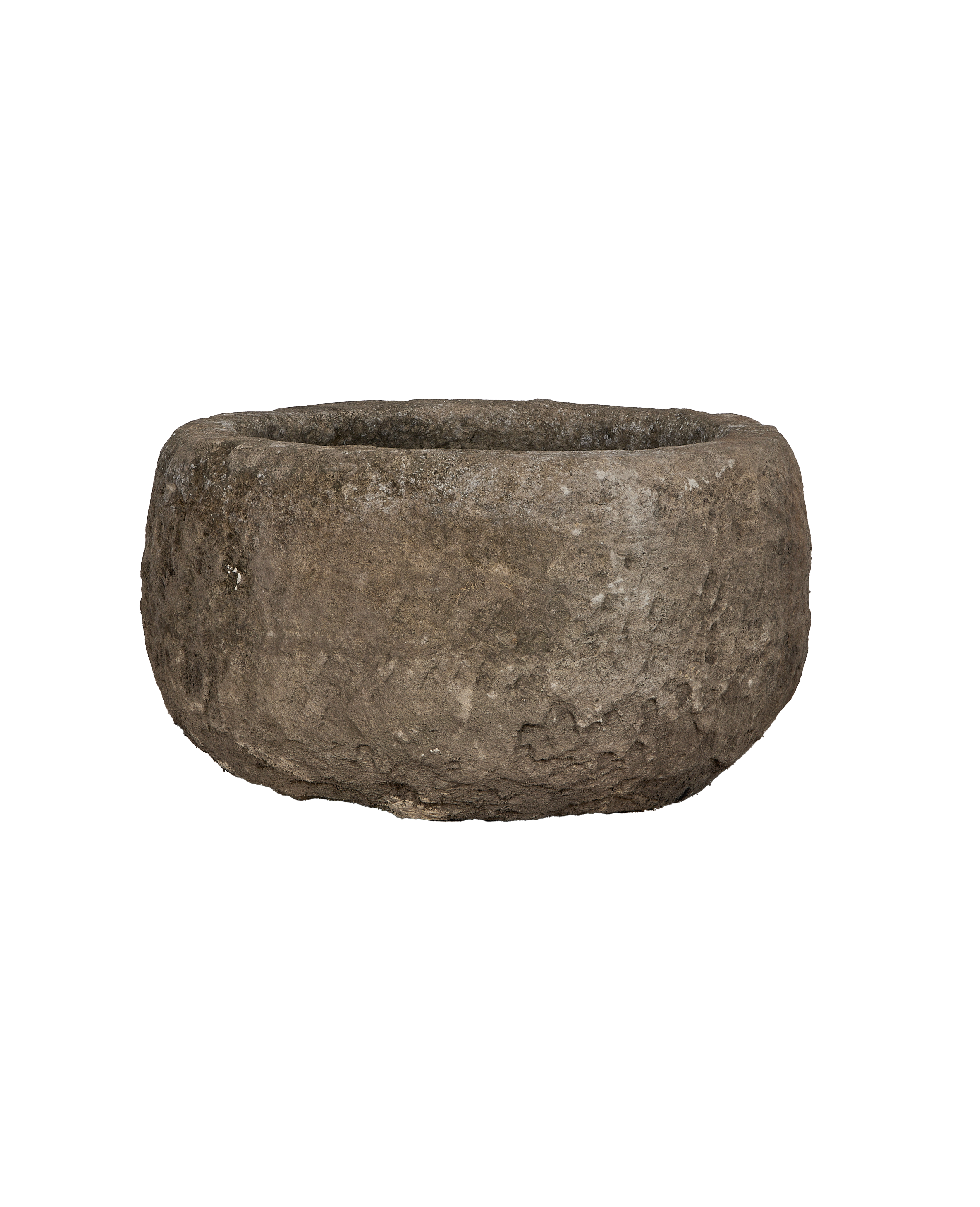 Vintage Indonesian round limestone trough, showing a slightly angled profile and textured surface.