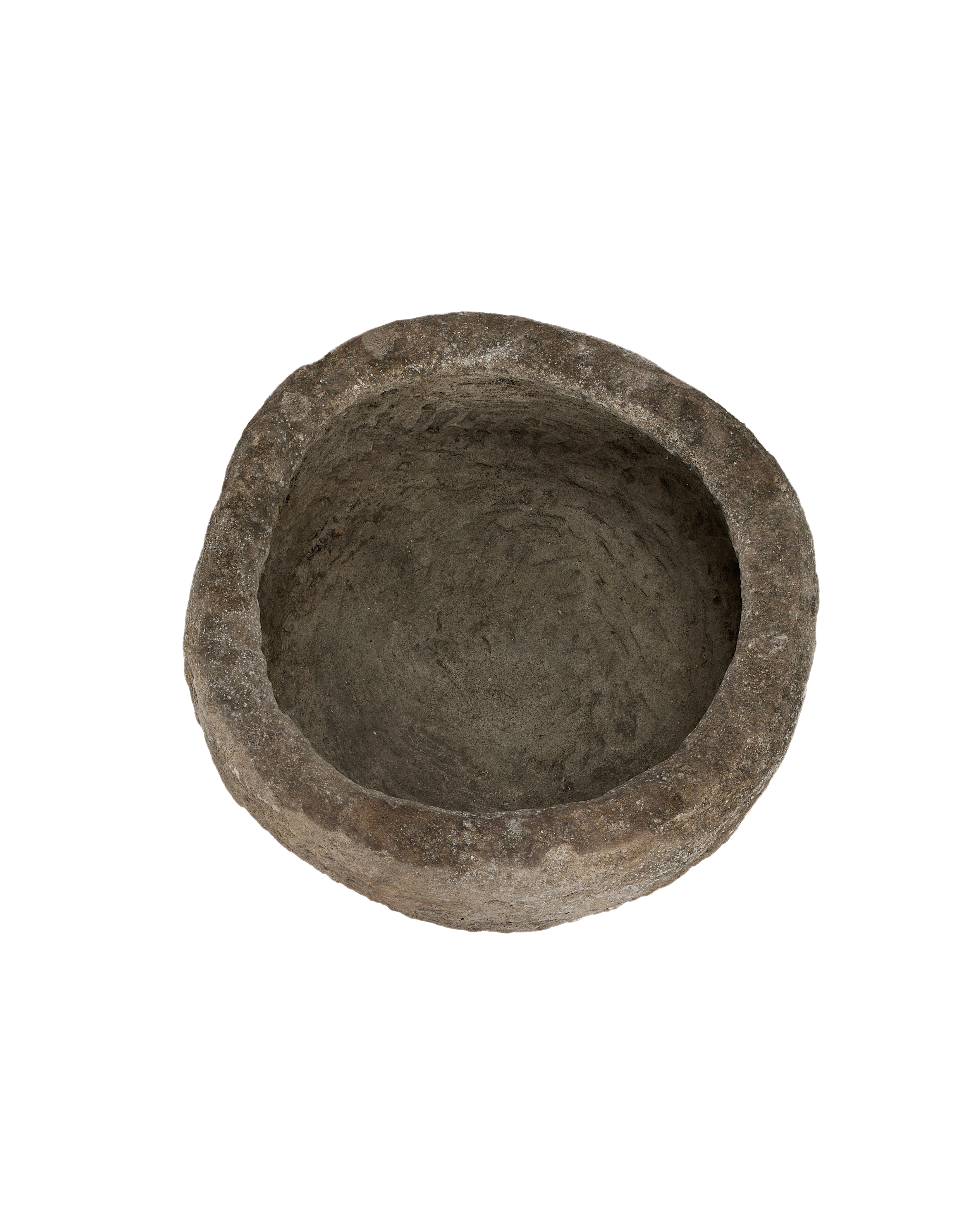 Vintage Indonesian round limestone trough, top-down view showing rough interior texture.