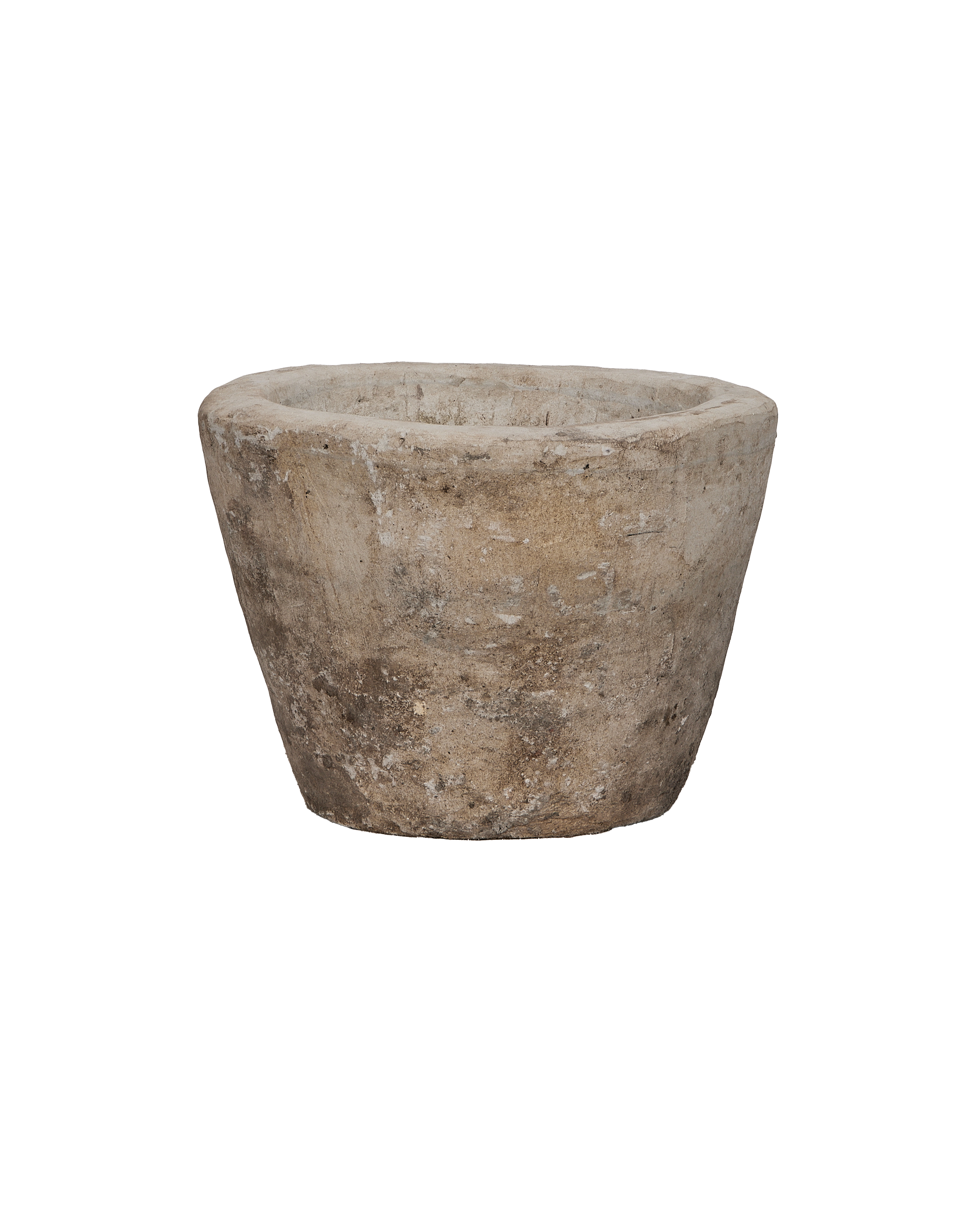 Vintage Indonesian round limestone trough, showing weathered texture from an elevated angle.