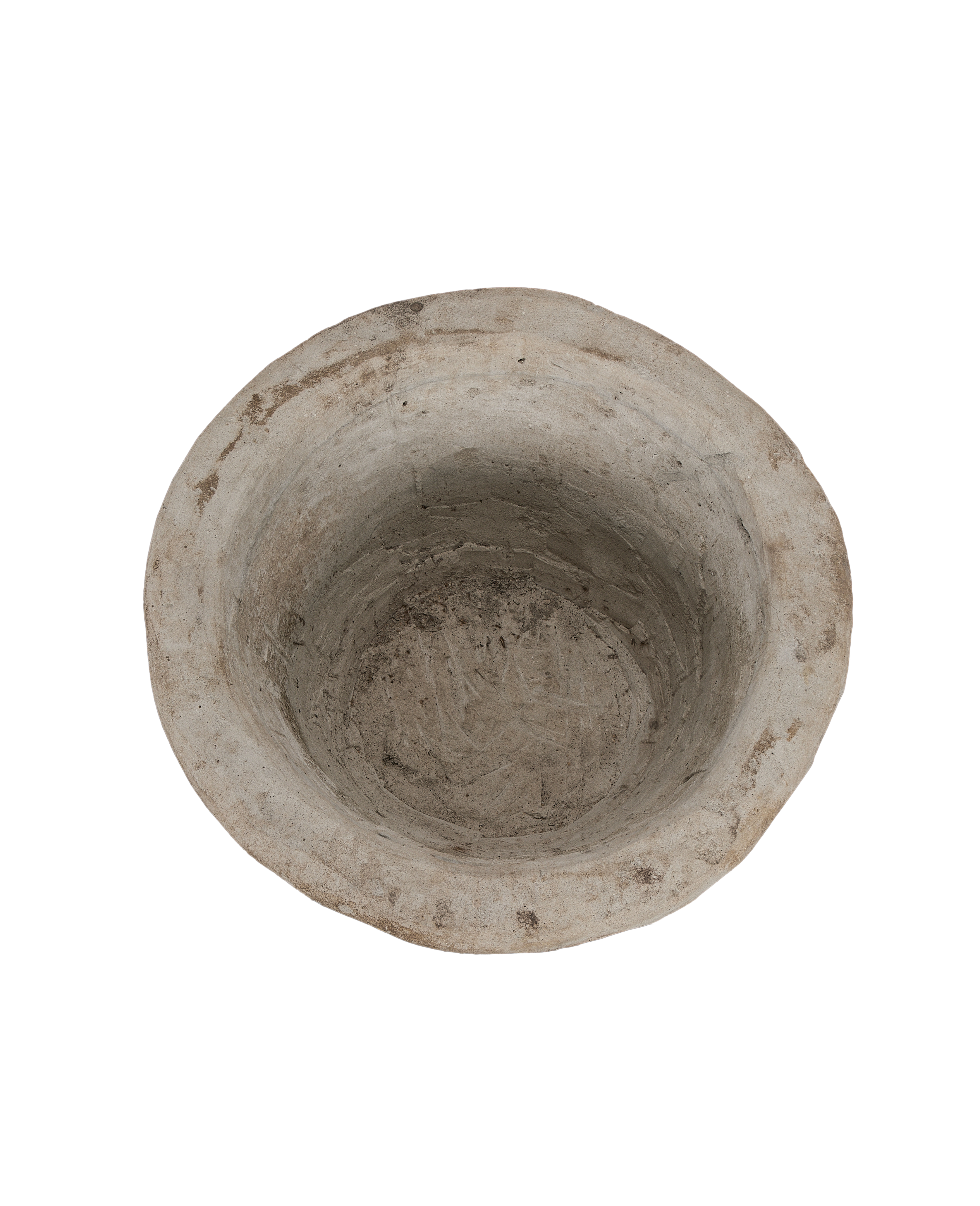 Vintage Indonesian limestone trough viewed directly into its well-worn, textured interior.