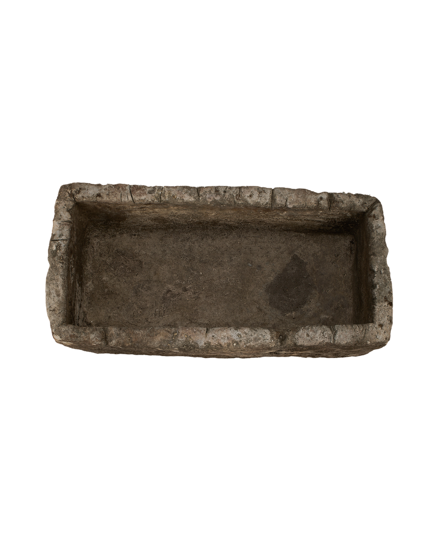 Vintage Indonesian rectangular limestone trough, top-down view showing interior depth and rough-hewn texture.