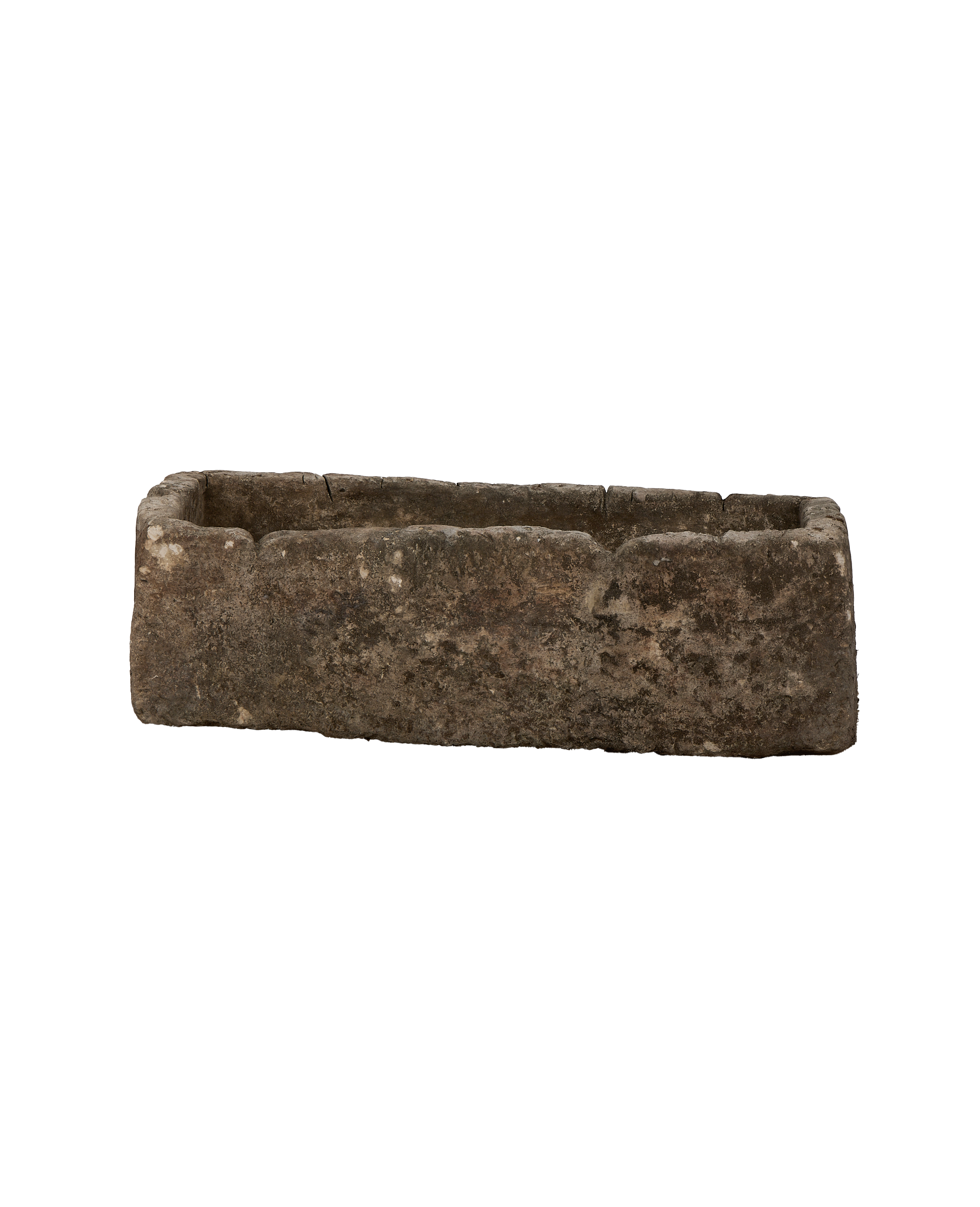 Vintage Indonesian limestone trough viewed from inside, showing rough texture and weathered finish.