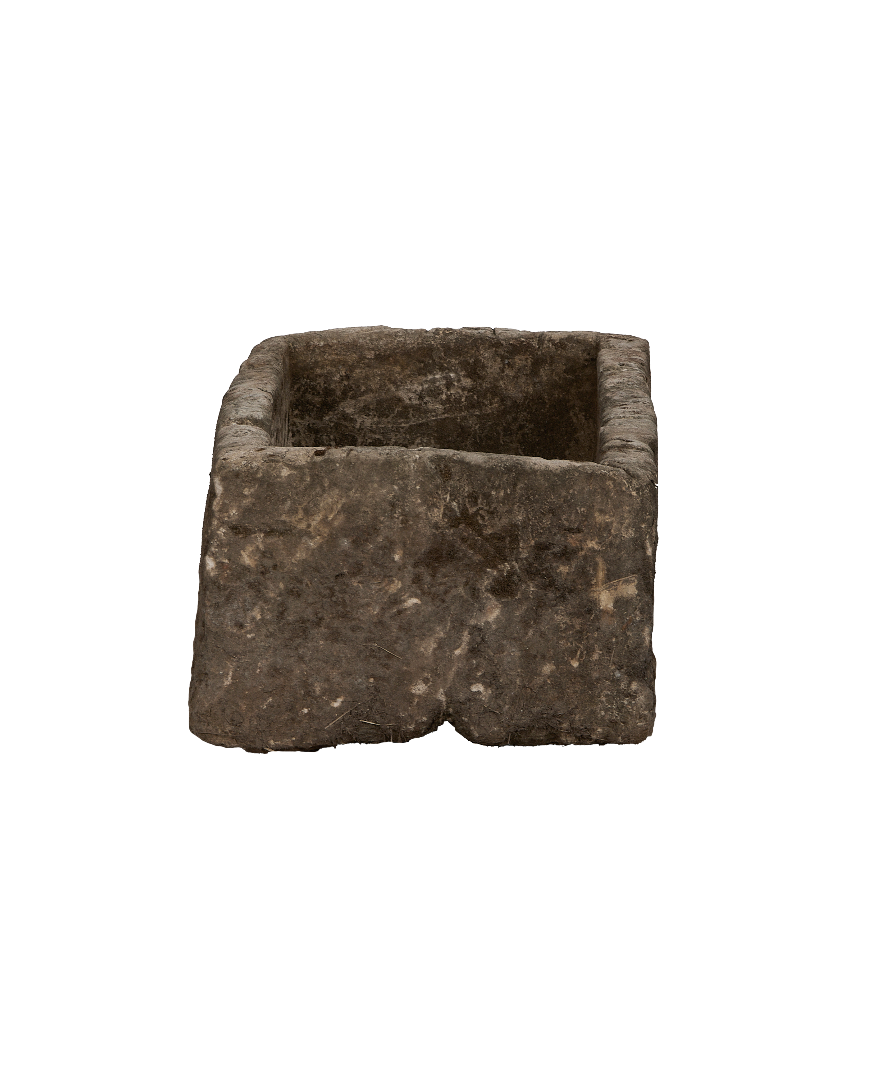 Vintage Indonesian limestone trough viewed from 3/4 angle, showing its rough, weathered texture.