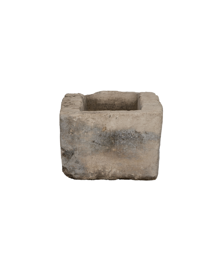 Vintage Indonesian limestone trough, top view highlighting rough texture and rectangle opening.